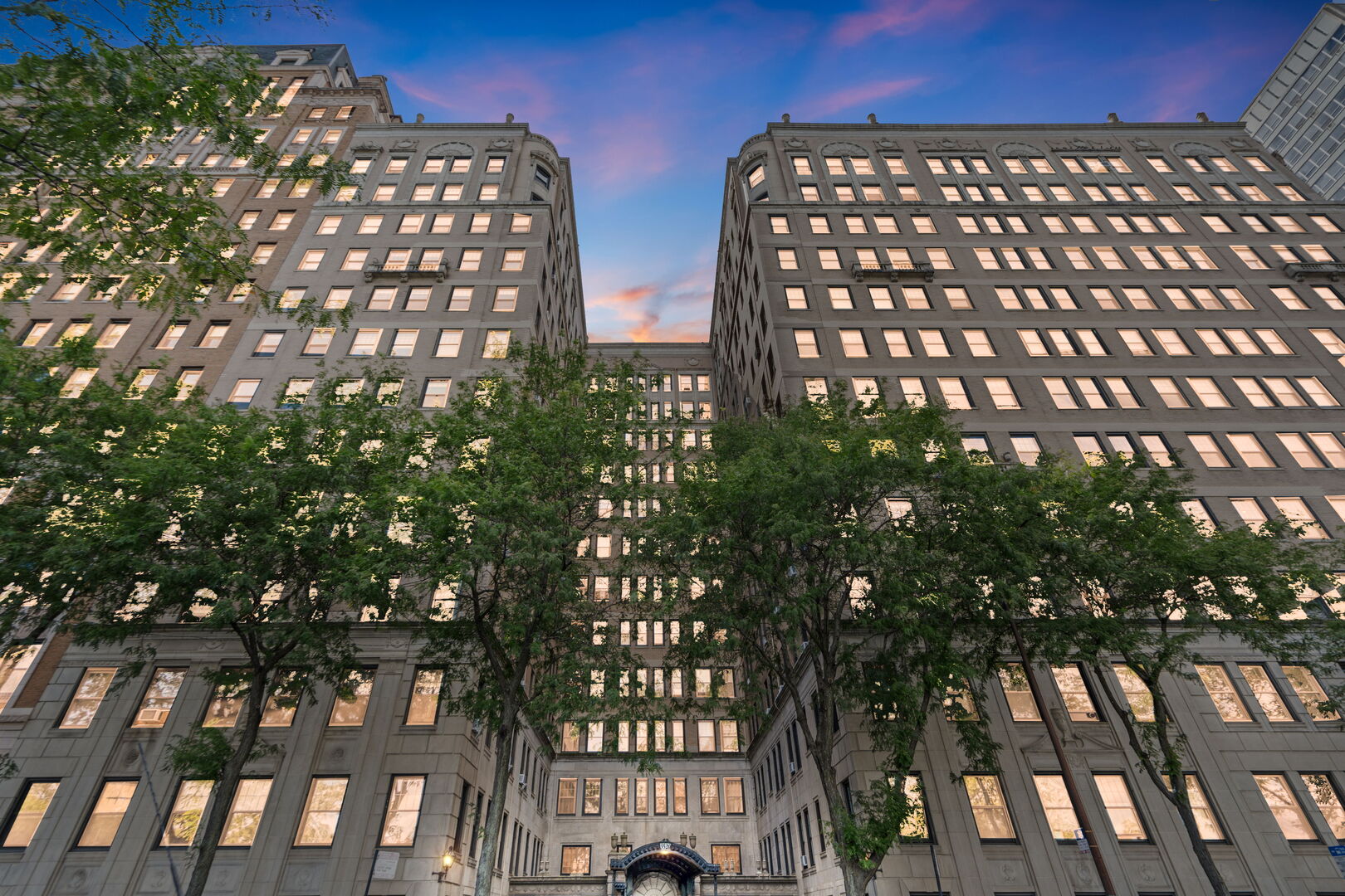 Live in this stunningly stylish blend of modern elegance and vintage charm! Spacious 1800sf 2 bedroom + den / 2 bath condo located in a boutique Lake Shore Drive elevator building designed by Rissman and Hirschfeld. This professionally managed pre-war gem offers privacy with only two units per floor. Step into a world of luxury with a dramatic foyer, formal living & dining rooms, hardwood floors, arched doorways, high ceilings, custom millwork, and designer lighting. Chef's kitchen boasts custom cabinetry, quartz counters, stone backsplash, floating shelves, and Thermador appliances. The in-unit washer/dryer and four portable A/C units are included. The building amenities include a supplemental laundry room, dry cleaner, receiving room, newly remodeled gym, bike room, mini convenience store, and two charming courtyard areas for entertaining. Nestled on a tree-lined, one-way street in the sought-after Nettlehorst school district, you'll enjoy proximity to the lake, golfing, Wrigley Field, Whole Foods, Jewel, restaurants, shops, cafes, and all that Lakeview has to offer. Downtown is easily accessible via the nearby CTA express bus, with rental parking available nearby. Truly a gem of a home!