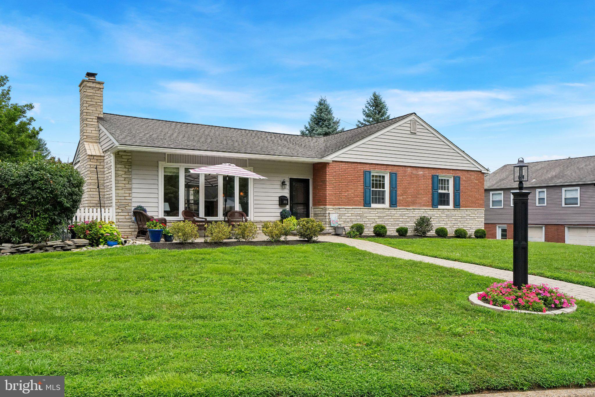Set in the sought after Merion Golf Manor, 2721 Pine Valley Lane is a beautifully maintained Three Bedroom Rancher offering the ease of one level living, a natural floor plan, and exceptional indoor/outdoor space. The home has an effortless flow from room to room, beginning with an inviting Living Room anchored by a fireplace and filled with natural light. The Kitchen and Baths have been thoughtfully renovated with timeless finishes and a classic aesthetic. Three comfortable Bedrooms and Three Full Baths are complemented by a dedicated Office, offering the flexibility to easily serve as a Fourth Bedroom if desired. The Finished Lower Level adds another dimension to the home, providing valuable additional living space with room to gather, relax, entertain, or adapt to changing needs. Outside, the property truly shines. Beautifully maintained grounds frame multiple outdoor living spaces, including a spacious Fenced Patio with distinct areas for dining and lounging. A fire table and café lighting create an inviting atmosphere for evenings outdoors, while an additional front patio offers another place to sit and enjoy the surroundings. The expansive lawn and mature landscaping complete a setting that feels open, private, and exceptionally well cared for. The home pairs a peaceful residential setting with the accessibility that makes this pocket of the Main Line so desirable. With the ease of ranch style living, timeless interiors, generous outdoor spaces, and an exceptional location, 2721 Pine Valley Lane offers a rare combination of comfort, character, and convenience.