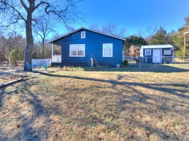 Quiet country setting just minutes from Lake Thunderbird. Home features an all-new kitchen (2023) with butcher block counters, new sink, new stove and dishwasher, fresh paint, updated fixtures, and vinyl plank floors throughout the home.  The bathroom was also refreshed with a new vanity, mirror, sink, and shelves for storage. Includes inside utility area, new hot water heater, barn doors, central heat/air (propane).  Outdoors offers a covered back patio, fenced yard, carport with multiple storage buildings, an in-ground storm shelter was added in 2023, and mature trees. The property has a gate for security, and parking, septic, and electric for an RV, tiny home, or future shop. Award-winning schools (Lakeview, Longfellow, Norman North) and easy access to Tinker or OU.