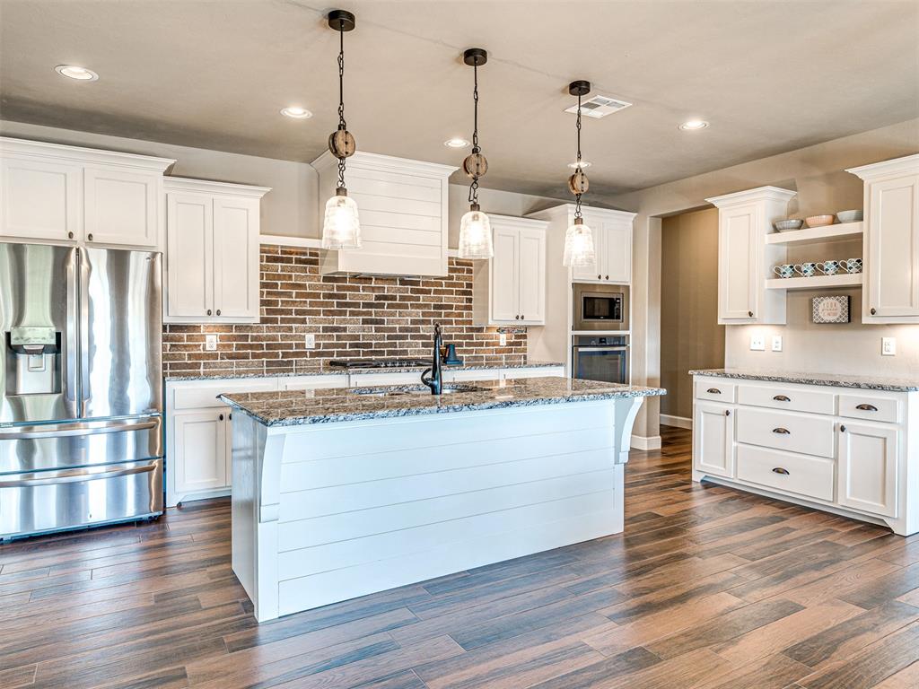 MOVE-IN READY!  Better than NEW! This home is located in the small but quaint Edgewater neighborhood in Moore, OK.  You can quickly get to Moore, Norman, South OKC, Tinker AFB, I-35 & I-240 from here.  Once inside you will love the beautiful kitchen with white cabinets, a nice sized island and lots of windows on the back side of the house that allows a lot of natural light to illuminate the common space areas.  This home could be a 3 bedroom plus a study or just 4 bedrooms with 2-1/2 bathrooms.  Other amenities are lawn sprinklers, full gutters, fenced yard, a storm shelter, an air cleaner (ultraviolet germicidal irradiation) attached to the HVAC system & additional insulation was added in the attic. Plus, the refrigerator, washer & dryer & outside grill can stay too.  The only thing missing is YOU!