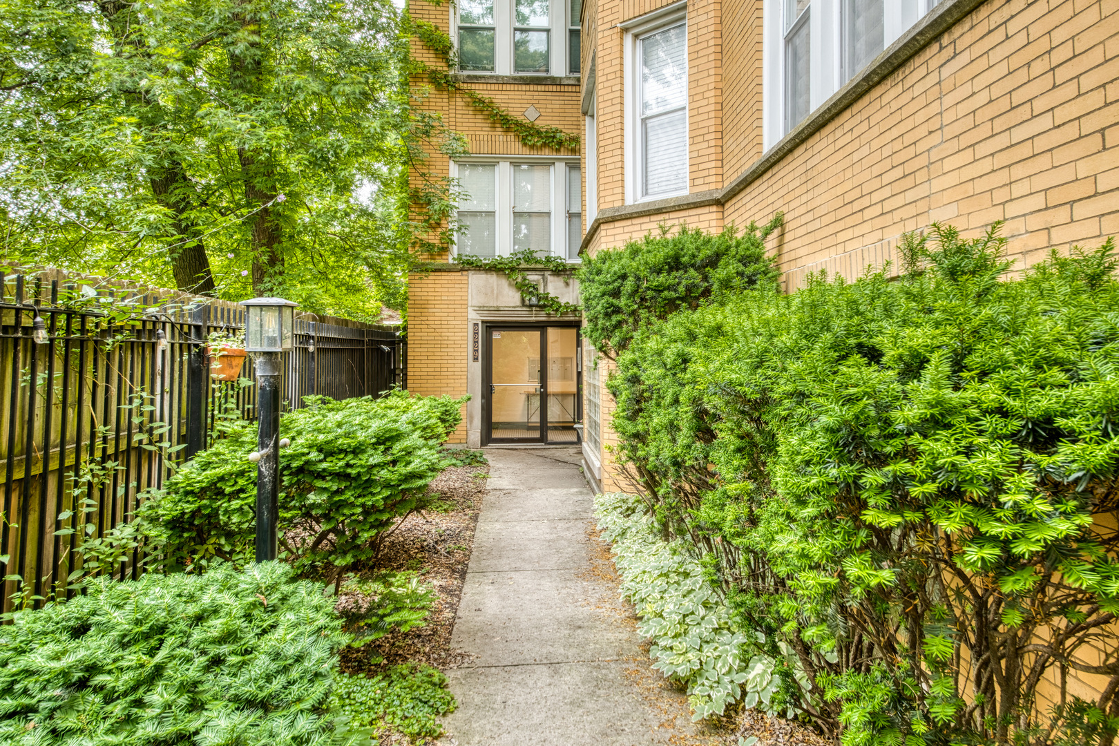 Stylish, spacious, and tucked away in one of Logan Square's most vibrant pockets, this updated one-bedroom condo offers charm, comfort, and unbeatable location. Set back from Kimball Avenue in a classic yellow brick building, the home has been thoughtfully customized with modern updates and clever storage throughout, making it live large for a one-bedroom.  The bright and inviting living room features an exposed brick wall, electric fireplace, and flexible layout that can easily accommodate a home office or additional dining space. The sunlit, eat-in kitchen is equipped with newer stainless steel appliances and an oversized, fully organized pantry-perfect for everyday living and entertaining. The recently refreshed bathroom nods to vintage charm while offering a large linen closet for extra storage.  Additional highlights include in-unit laundry, massive basement storage, and a functional outdoor space ideal for morning coffee or a potted herb garden.  Situated just a few blocks from Palmer Square Park and the CTA Blue Line, this home places you in the heart of everything Logan Square has to offer-boutique shops, cafes, award-winning restaurants, farmers markets, and the neighborhood's iconic boulevards.