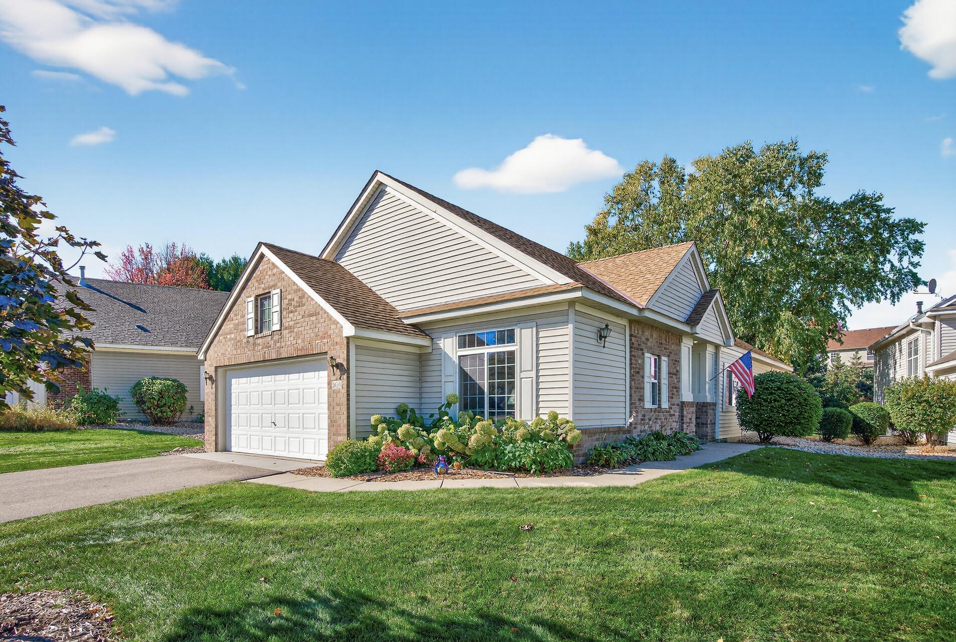 Discover the ease of main level living in this well cared for detached townhome in the highly desirable Woodbury Crossing community!  Perfectly positioned just minutes from top shopping, dining, and local conveniences, this meticulously maintained original owner home combines everyday comfort with a low maintenance lifestyle.  The open concept design welcomes you with soaring vaulted ceilings and abundant natural light that creates a warm, spacious feel throughout.  A cozy gas fireplace anchors the living room, while the adjoining sunroom offers the perfect spot to unwind with morning coffee or a good book.  Step outside to your private patio featuring a retractable awning, ideal for relaxing or entertaining while enjoying peaceful, wooded views on the best lot in the development. With two generous bedrooms and a flexible den, there’s plenty of space for guests, work, or hobbies. You’ll love the quiet setting and great layout. Welcome home!