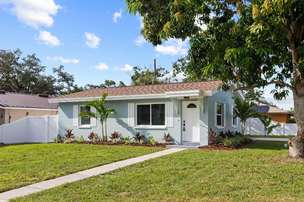 Welcome home to this beautifully remodeled 2-bedroom, 1-bath block home in Largo! Situated on a corner lot in a **non-flood zone with no HOA**, this move-in-ready home has been tastefully updated from top to bottom.Major improvements include a new roof, double pane impact windows, HVAC within the last 2 years, and a complete permitted electrical rewire in 2024—giving you the peace of mind that comes with substantial upgrades already completed.Inside, the showpiece is the beautiful new sage green kitchen, featuring all-wood cabinetry, quartz countertops, and brand-new stainless steel appliances.  The home has new luxury vinyl plank flooring throughout, and fresh interior and exterior paint. Outside, enjoy fresh landscaping, a fenced-in yard, and a mature mango tree in the front yard. The covered carport includes a separate laundry room, providing additional functional space beyond the home's 768 heated square feet.With its extensive renovations, major system upgrades, non-flood-zone, and convenient location close to Indian Rocks beach, this home offers the charm of an established neighborhood with the feel of a completely refreshed home. Nothing left to do but move in and enjoy!