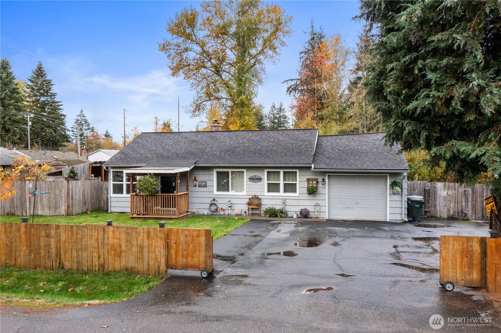 Cute country charmer on 1 acre! This delightful 2-bedroom, 1-bath home includes an office/den and a spacious bonus room. Relax by the cozy wood-burning stove or enjoy morning coffee on the covered country porch. A large deck off the back is perfect for entertaining or taking in the peaceful view of the seasonal pond and gardens—a true gardener’s delight! The property also features a 24x30 detached shop/garage, ideal for hobbies or extra storage. NO HOAS! RV Parking. Opportunities are endless! Conveniently located for easy commutes and close to amenities while still offering that quiet country lifestyle.