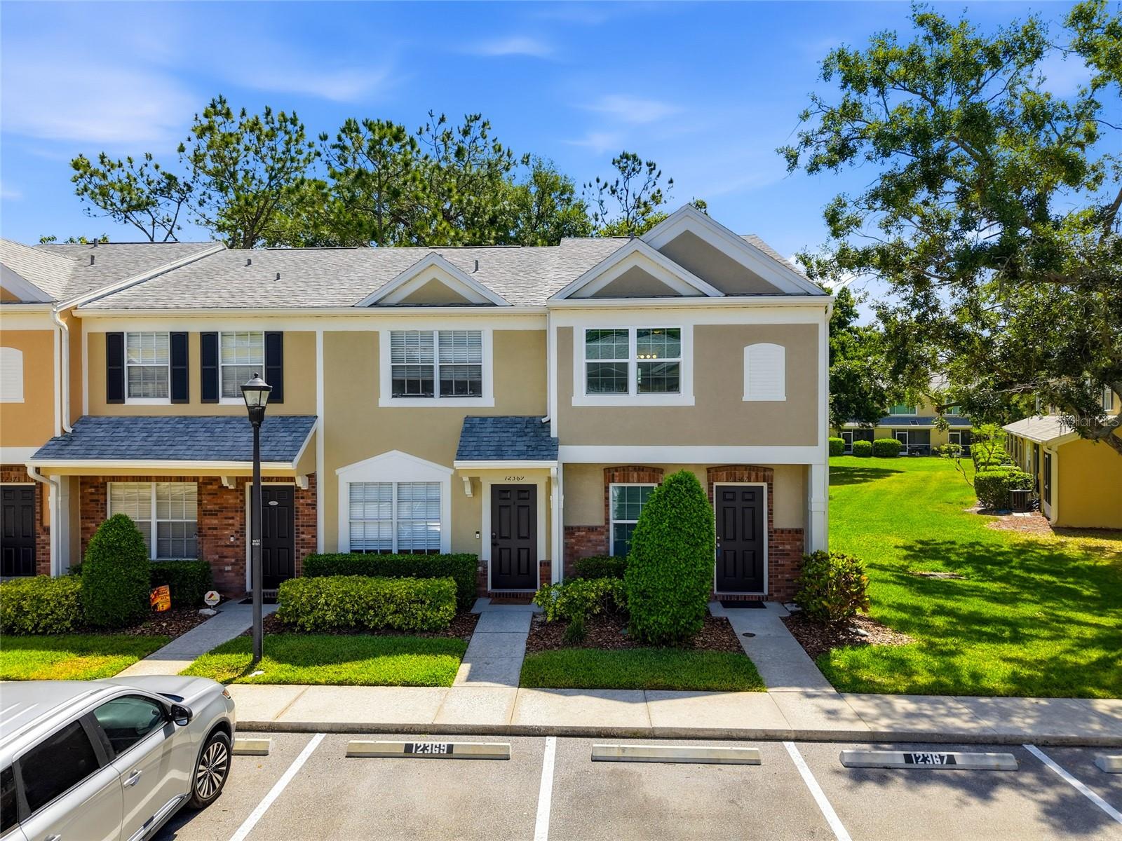 One or more photo(s) has been virtually staged. This charming 2-story, 2-bedroom, 2.5-bathroom townhome located in the highly sought-after Berkeley Square in the award-winning Westchase community offers 1,184 sq. ft. of comfortable, low-maintenance living. The inviting main floor features a spacious living and dining area, a well-equipped kitchen with stainless steel appliances (refrigerator 2018, dishwasher 2023, stove 2026), a convenient half-bath, and a laundry closet with washer and dryer (2021). Your serene private screened-in lanai offers a quiet space to enjoy the green landscaping maintained by the HOA. Upstairs, retreat to the generous primary suite complete with an en-suite bathroom and dual closets. The sizeable second bedroom is perfect for guests or a home office, featuring ample closet space and en-suite bathroom. The owner had NEW HURRICANE RATED WINDOWS installed in 2024. HVAC 2019, Waterheater 2025 Enjoy a the world-class amenities: community pools, lighted tennis and pickleball courts, neighborhood parks, miles of walking trails, and the renowned 18-hole Westchase Public Golf Club. Zoned for top-rated schools, this location is a short distance to Westchase Town Center's Publix, boutiques, cafes, and dining. Enjoy an easy commute to Tampa International Airport and the Gulf beaches. Don't miss this fantastic opportunity to secure a home in one of Tampa’s premier zip codes!