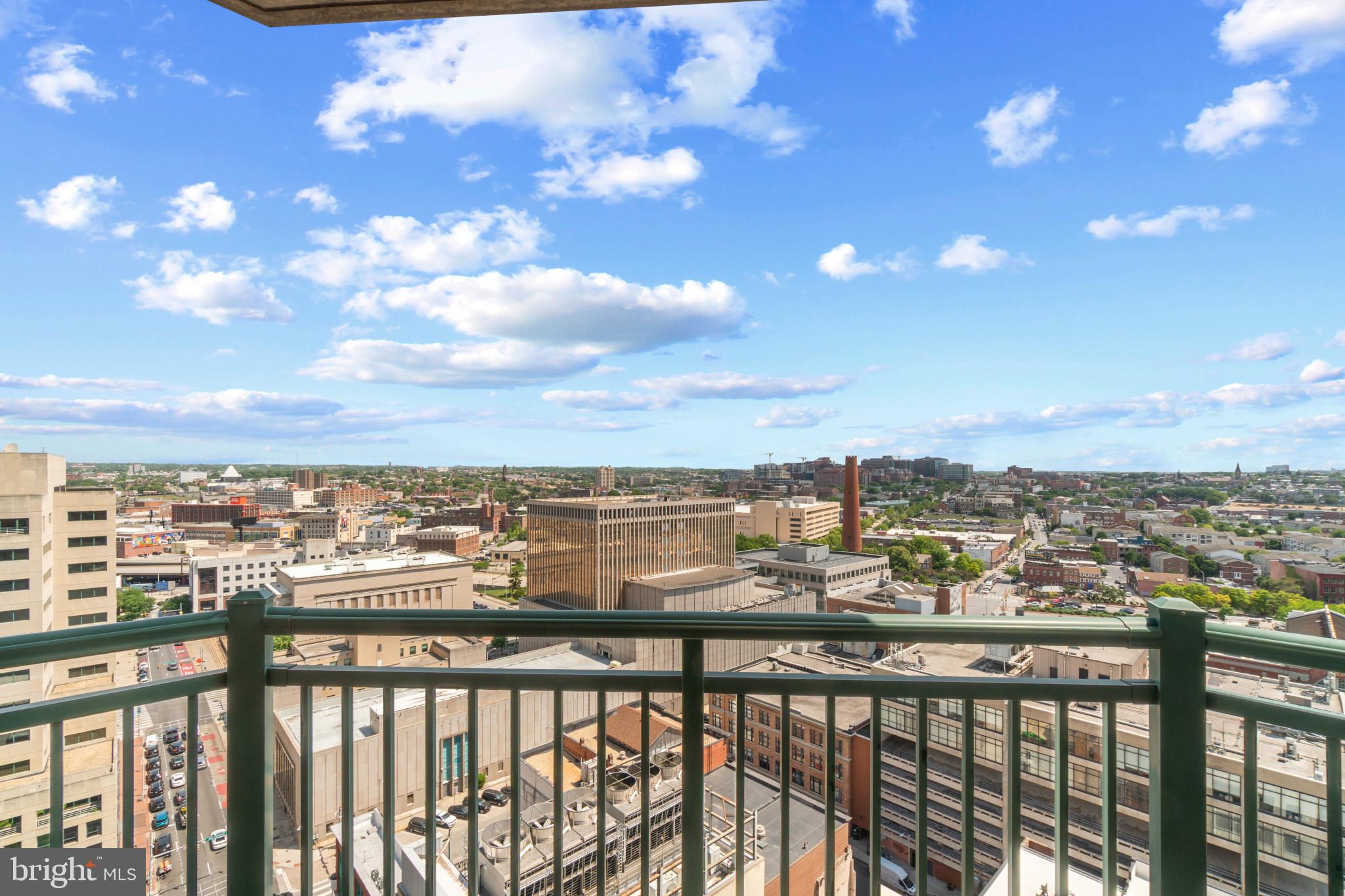 Outstanding, lightly used,  corner unit in 414 Water Street offering panoramic views east and across the harbor close to The John Hopkins Hospital and University of Maryland Medical Schools .This unit boasts new hardwood floors and new stainless steel appliances (2021).  The kitchen in this corner unit with high breakfast bar for seating is set back and overlooking an expansive living room with your own gas fireplace which provides both comfort atmosphere in your new city home.2 large bedrooms with 2 full bathrooms provide ample and private spaces to relax.  Finally, your private balcony has sweeping views overlooking Baltimore city and the Inner harbor. 1 parking spot included