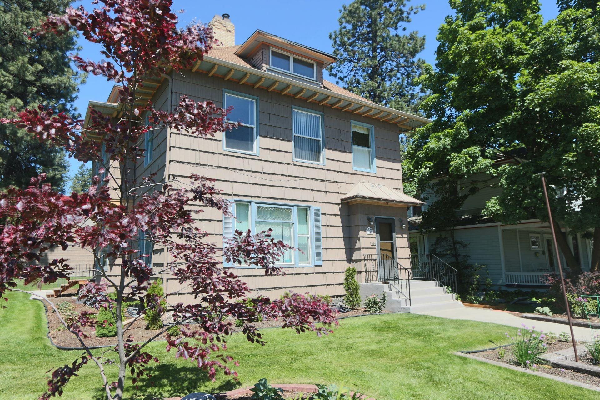 Historic 5-plex mansion in Browne's Addition situated on corner lot and located just 1 block from Coeur d'Alene Park.  Separately metered, coin laundry, well maintained, fully occupied and with good rental history.  3 garages.   Full unfinished basement with 8' ceilings is framed in and could be finished to add another 800 sqft apartment.   Mix consists of two studios and three 2-bedroom units.