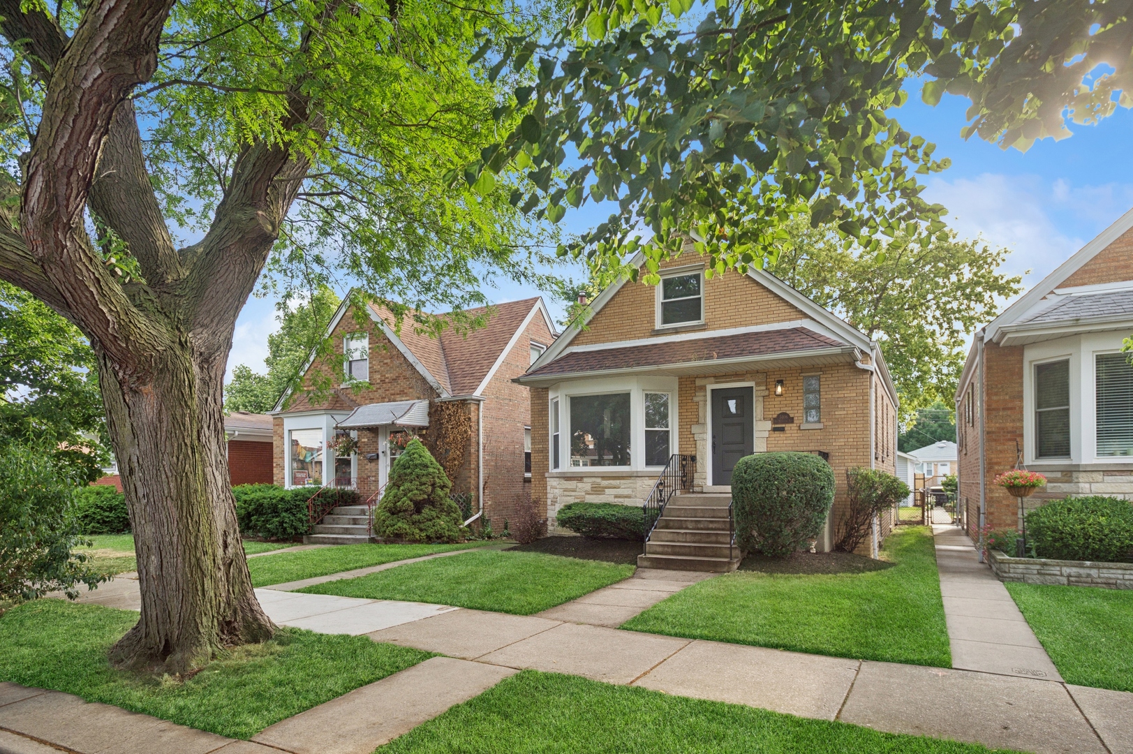 Stylish, Spacious & Fully Renovated in the Heart of Jefferson Park!  This beautifully updated 4-bed, 2.1-bath home blends timeless charm with modern comfort. From the moment you step inside, you'll notice the warm white oak-stained hardwood floors and natural light pouring in through energy-efficient vinyl windows. The open-concept main level features a generous living room, two bedrooms, and a full bath-ideal for flexible living or guest space.    The showstopper kitchen was fully gutted and reimagined with quartz countertops, white shaker cabinetry, stainless steel appliances, and a classic subway tile backsplash. A cozy, finished porch just off the kitchen offers the perfect bonus space for a home office, reading nook, or playroom.    Upstairs, you'll find two more bedrooms and a convenient half bath. The fully finished basement-complete with exterior access-boasts a spacious family room, custom wet bar, a sleek full bath with walk-in shower, dedicated laundry area, and ample storage.    Major updates include: new HVAC & A/C condenser, new 2-car garage, copper plumbing, upgraded 100-amp electrical panel, spray foam insulation, and all-new mechanicals-ensuring peace of mind for years to come.    All this in a fantastic Jefferson Park location near parks, top-rated schools, shopping, Metra & Blue Line, and easy expressway access. Truly a turn-key gem you don't want to miss!