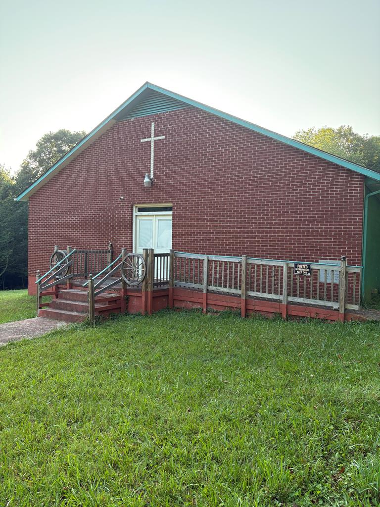 Here is your opportunity to own 2 buildings formally used as Church buildings sitting on 1.47 acres at the end of a road, with country views! Whether you are looking for a Church building for your congregation; a building to turn into rentals; A building for a great start of your own home; this is the place for you! Both of the buildings have had new wiring ; with shutoffs in 4 breakers for each building.  The largest of the 2 building is approximately 3200 square feet and has 2 offices, a full and half bath; a kitchen area, along with the huge open area formally used for meetings and church services.  The smaller building has 910 sq ft; and according to the Seller; it is a historical piece. The walls inside the smaller unit have been removed and it has new wiring installed ready to turn it into whatever your heart desires.  Don't miss this opportunity to own something you can make your own.