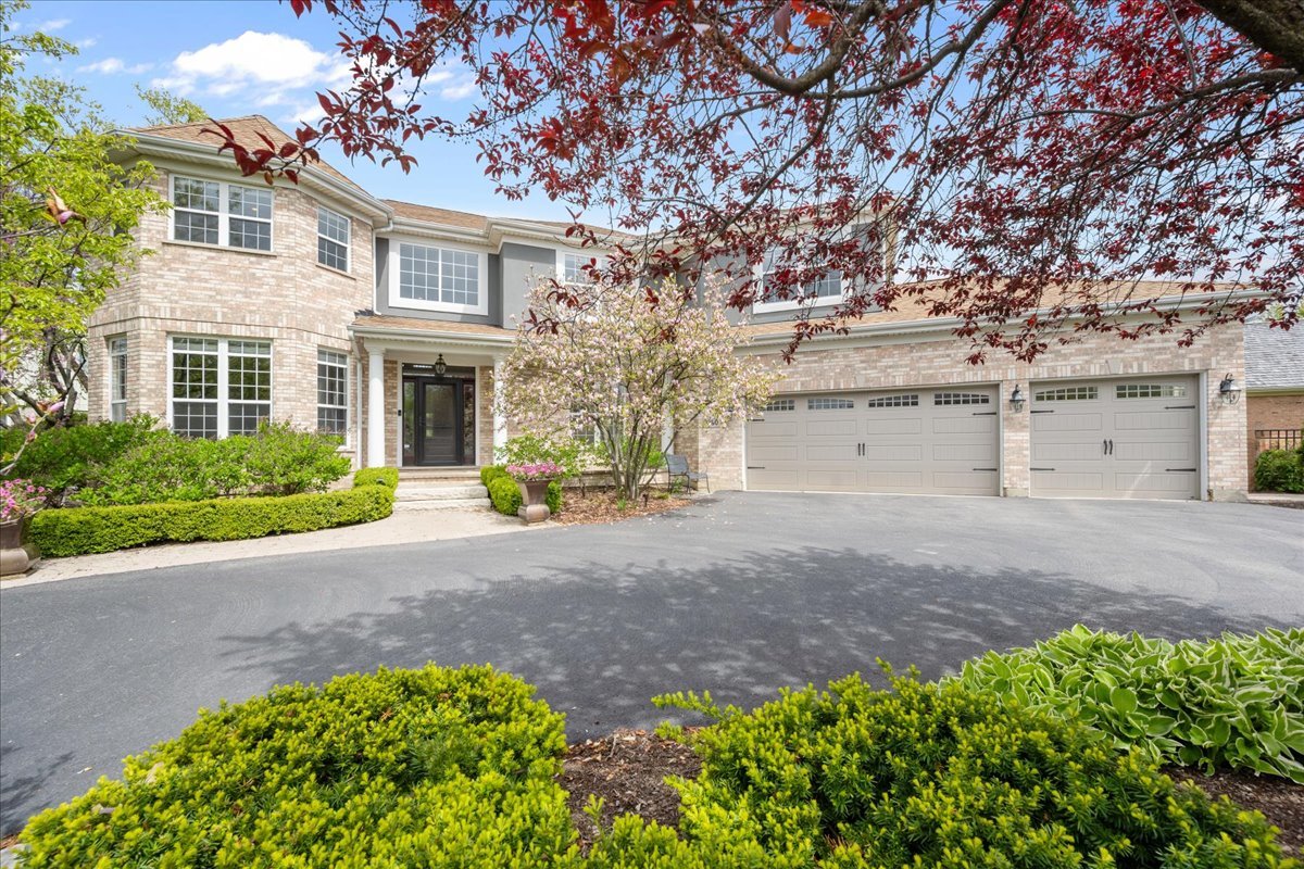 Every inch of this stunning home has been thoughtfully updated and stands out for all the right reasons.  Set in the sought-after Stonegate neighborhood of Northbrook, this home brings together space, layout, and a level of improvement that's hard to replicate. Positioned on the largest corner lot in the neighborhood, it offers both presence and privacy.     Four generously sized bedrooms and three full, recently renovated bathrooms, along with a second-floor laundry room, create the ideal layout upstairs.  At the center of the home is the recently renovated kitchen that truly delivers in both function and design. A full suite of high-end appliances-including a Sub-Zero refrigerator, Bosch ovens and dishwasher, and Miele cooktop-pairs with granite and quartz countertops and a walk-in pantry that keeps everything within reach but out of sight. Hardwood floors run through the main living spaces, adding warmth and continuity, while the kitchen opens naturally to the family room, connected to the living room, library and office.  Step outside and you'll see where this home really separates itself. The backyard has been completely reimagined with a beautifully designed patio, built-in grill, pergola, fire pit, and a sports court-creating a space that works just as well for a quiet night as it does for a full house.  The finished basement adds another layer of flexibility, with additional living space, a bedroom and full bath, storage, wet bar and wine cellar!    What you don't always see-but will appreciate-is the extent of the updates behind the scenes, including the roof (2018), new driveway (2021), mechanicals (2025), and sump pump with two battery backups.  Additional highlights include a three-car garage with new doors, epoxy floors, and an EV charger, along with a full security setup and Ring cameras installed inside and outside the home.    All of this, set within a neighborhood known for its sense of community, access to parks, tennis and pickleball courts, and top-rated schools. This incredible home offers both comfort and convenience in one of Northbrook's most established neighborhoods.