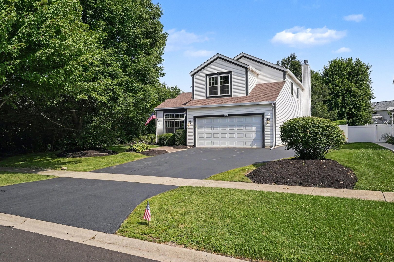Wow, welcome home! This incredible, move-in-ready 5-bedroom, 3.5-bathroom gem is perfectly situated on a peaceful dead-end street, offering beautiful curb appeal and serene views of neighboring cornfields. Step inside to find an abundance of natural light accentuating the fresh paint and gleaming hardwood flooring that flows throughout the expansive main level. The layout boasts both a spacious living room and a large family room complete with a cozy fireplace, a formal dining room, a bright breakfast nook, and a beautifully updated kitchen featuring quartz countertops and stainless steel appliances. A rare main-level bedroom (or bonus room) alongside a full bath adds fantastic flexibility. Upstairs, you will find four generously sized bedrooms, including a huge primary suite with a large, private bathroom. The massive finished basement provides endless entertainment space and a convenient half bath, while the lovely backyard and 2-car garage complete the package. Located just minutes from top-rated schools, local shops, and beautiful parks, this home truly has it all-book your showing today!