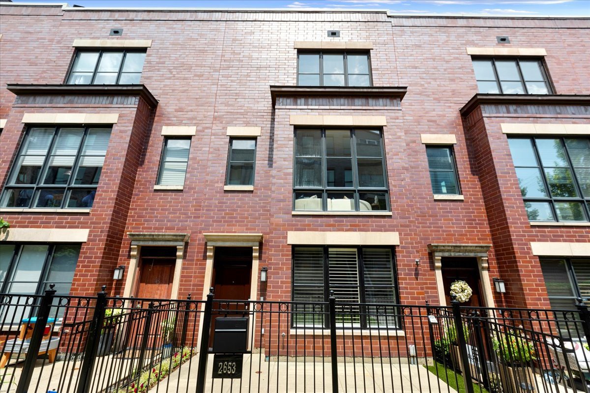 Your search is over! Huge, highly upgraded, 5 br/4 and a half bth solid brick townhome on serene tree-lined street in wonderful Hartland Park! This townhome lives like a single-family home and offers spacious rooms, an open layout, a thoughtful floor plan ideal for family living and entertaining, and stunning high-end finishes throughout. 1st level features gracious foyer opening to office/playroom/5th bedroom w/ rare full bth, perfect for an au pair or out-of-town guests. 2nd level offers south facing living room w/ fireplace, custom built-ins and oversized windows. Separate dining room that easily accommodates a large table. Half bth. Awesome professional grade chef's kitchen w/ breakfast bar, top-of-the-line appliances, abundant cabinets, granite countertops and custom backsplash opening to separate family room and large deck. 3rd level features big ensuite bedroom w/ walk-in closet, plus two additional br's w/ full bath and laundry room w/ side-by-side washer/dryer w/ storage above. 4th level boasts luxurious primary suite w/ private south facing deck, two walk in closets, and natural stone spa bth w/ skylight, double bowl vanity, separate shower and large soaking tub. Hardwood floors. Solid core doors. Custom millwork, window treatments, paint & lighting. Zoned heat & air w/ two separate systems. Welcoming front patio. Attached 2-car garage w/ excellent storage. Professionally managed community offers terrific, resident-only playground, park, basketball court and dog run. Fantastic walk-to-everything location steps to Chi Che Wang Park, Wrightwood Park, restaurants, coffee shops, boutiques, groceries and highly rated Prescott School!