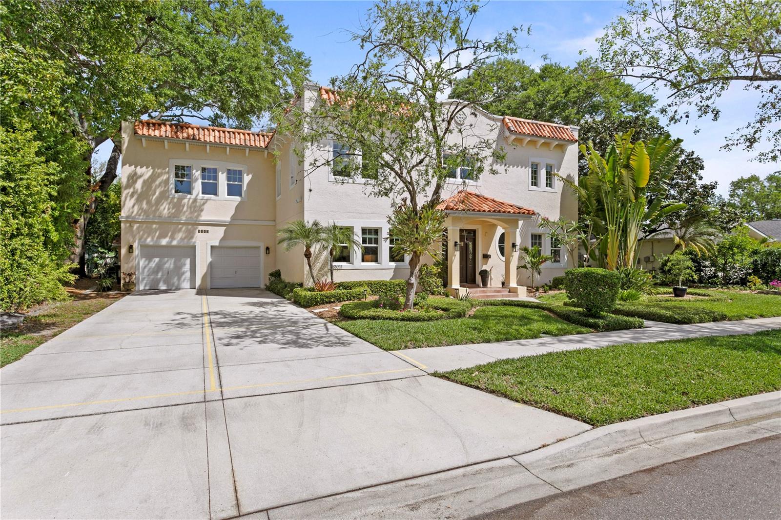 This stunning transitional Mediterranean 5-bedroom, 3.5-bath pool home is ideally located in the Palma Ceia West/Virginia Park area, one of South Tampa’s most desirable “NO FLOOD ZONE” neighborhoods, with wide, tree-lined streets and manicured lawns. Situated on a rare 100x100 lushly landscaped lot, this custom-built all-block home shows beautifully from every angle, with thoughtful design and luxury appointments in every space.Gorgeous dining room with 800+ bottle wine room, flexible office/den/library space and half bathroom with beautiful Venetian plaster finishing all flank the stunning entryway, with luxurious adornments such as hardwood flooring, 10-foot ceilings, rich crown moulding and baseboards, wood window casings, and solid core doors featured throughout the home.The newly painted true gourmet chef’s kitchen features custom cabinetry, granite countertops with center island and breakfast bar, high-end luxury stainless steel appliances, spacious closet pantry, and natural light pouring through the wall-to-wall windows. Thoughtful details like convenient refrigerated drawers, double ovens and microwave at custom height, and upgraded Wolf gas cooktop truly allow the house chef to make daily masterpieces.The formal dining room is truly a special space, with wrap-around windows and French doors with transom window that open to the lush side yard.  And just off the dining room, the wine lover will appreciate the spacious, temperature-controlled 800+ bottle wine room featuring built-in shelving and showcase spaces.The family room features a custom fireplace and French doors with transom window leading out to the incredible outdoor living space, which features a large covered entertainment area, heated saltwater pool and spa, firepit sitting area, tool/storage shed, a large side yard, tropical landscaping and splendid trees for shade.The second floor features the spacious owners retreat with ensuite bathroom, dual vanities/sinks, double walk-in closets, and private terrace, all providing tranquility and privacy from the rest of the home. Hardwood flooring in the stairwell and hallway leads to three additional bedrooms sharing a hallway bathroom with dual sinks and separate tub/shower room.  A large sun-filled laundry room with high-end LG washer and dryer and new quartz countertops, and an additional in-law suite, featuring a large separate sunlight-filled bedroom with large private terrace, flexible office/den/studio space, and full bathroom with natural light complete the upstairs space.Additional features include a newly painted interior, new fans and lighting fixtures, new stepping stone pathway from the driveway to the front door, oversized two-car garage with new high-end epoxy finish, and large front driveway providing ample parking space.  Walk to South Tampa's top schools, enjoy dog-walking along sun-dappled sidewalks, and the incredible shopping and dining options all within close proximity, including Publix, Sprouts, CVS and Michelin acclaimed restaurants.  No flood insurance is required, and no flooding has occurred in this high and dry property.Offering convenient access to the area’s best public and private schools, hospitals, premier shopping, dining, entertainment, TIA Airport, Downtown Tampa, bridges to the beaches, historic Bayshore Boulevard, and much more, this stunning home must be seen in person to appreciate all of the lovely touches and well-designed appointments.