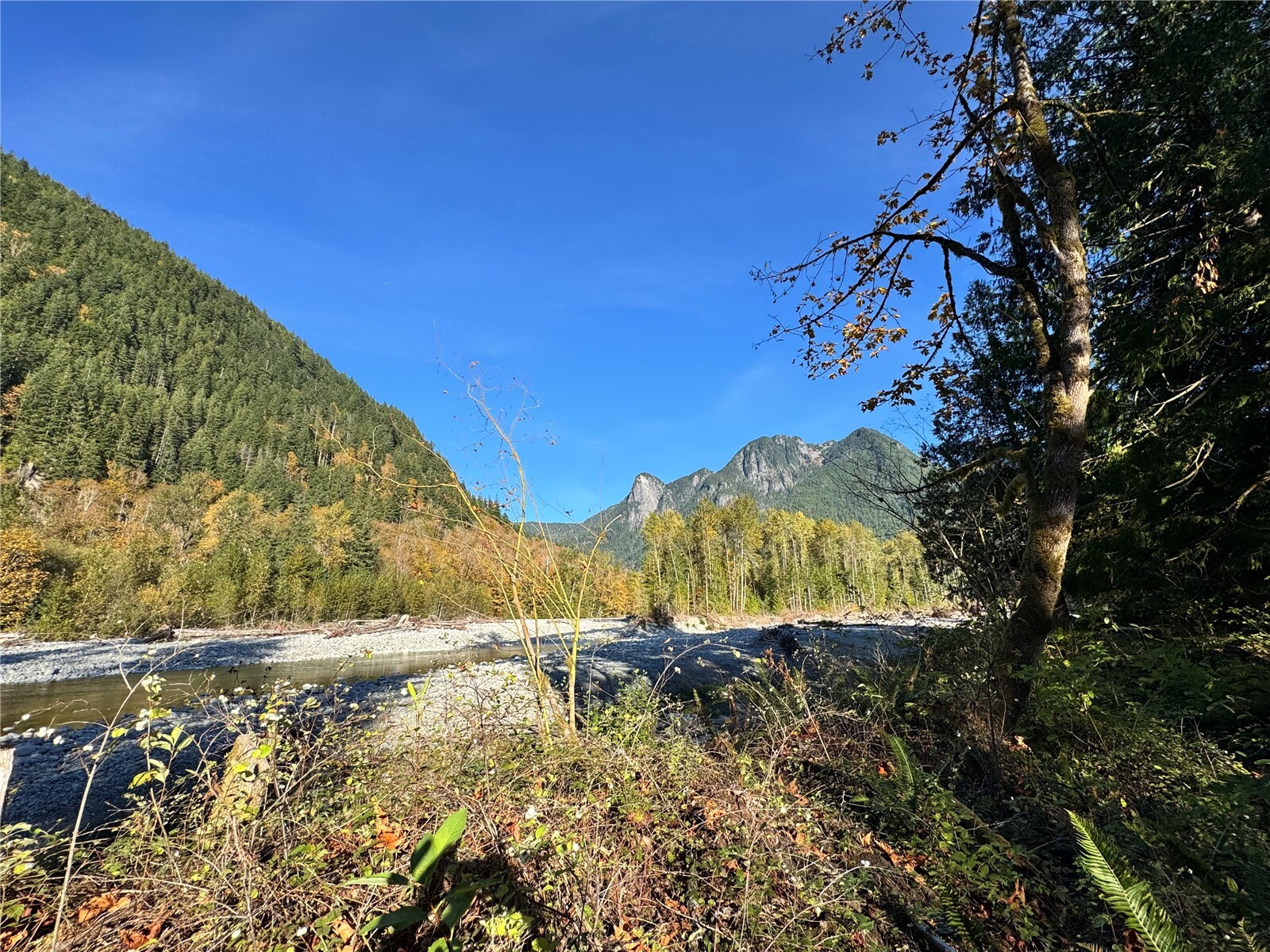 Imagine your own private riverfront retreat in the mountains, where the powerful North Fork Skykomish River and the beauty of the surrounding wilderness create an unforgettable natural setting. Offering approximately 0.47 acre of pristine riverfront land, this rare property is just minutes from Stevens Pass and provides an exceptional opportunity to create a custom cabin or mountain escape. A private gate opens to a thoughtfully cleared building site, while a shared well with the neighboring property and electricity available at the property line add convenience. The seller has also completed a previous percolation test. Bring your vision and experience the serenity, adventure, and year-round beauty of Pacific Northwest mountain living.
