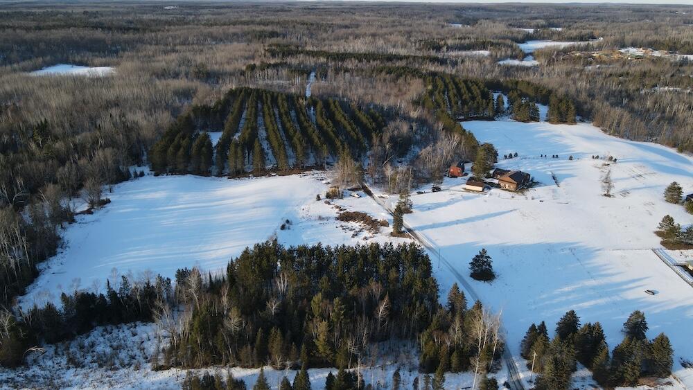 Discover this exceptional 4-bedroom, 2-bath home with over 3,500 sq. ft. of finished living space, set on 17 acres of prime country land, perfectly suited for horse lovers, outdoor enthusiasts, or anyone seeking privacy and tranquility. The property features a 3-acre hay field, pasture around the house, and a red pine stand, offering both beauty and function for a hobby farm or nature lover.This home is plumbed and ready for power, but electricity would need to be run throughout the home, giving the buyer the opportunity to wire it to their own specifications. The price has been set aggressively, well below the recent appraisal, to allow for this work to be completed to the new owner's specifications. Inside, enjoy bright, open living spaces, a functional kitchen and dining area, and a partially finished walk-out basement ideal for a family room, recreation, or storage. Wood heating, plus a propane water heater, provides year-round comfort.There is also a complete in-floor heating system throughout the home, currently run from solar but could also be converted to propane if the new owner desires.The home also features a huge screened-in porch with panoramic views of the countryside, perfect for family gatherings or relaxing while watching the sunset.The large detached Gambrel barn has 4 horse stalls on the lower level and a large upper area perfect for hay, equipment, or general storage. Additional outbuildings include a shed and a large detached 2-car garage (24' x 32') for even more storage. A potential pond site lies across the drive to the west side of the easement, adding to the property's versatility.With maintained paved roads and a serene, private setting, this property combines function and peace. Whether you're looking to raise horses, hunt, or enjoy your own private retreat, this is a rare opportunity to embrace country living with space, privacy, and endless possibilities.