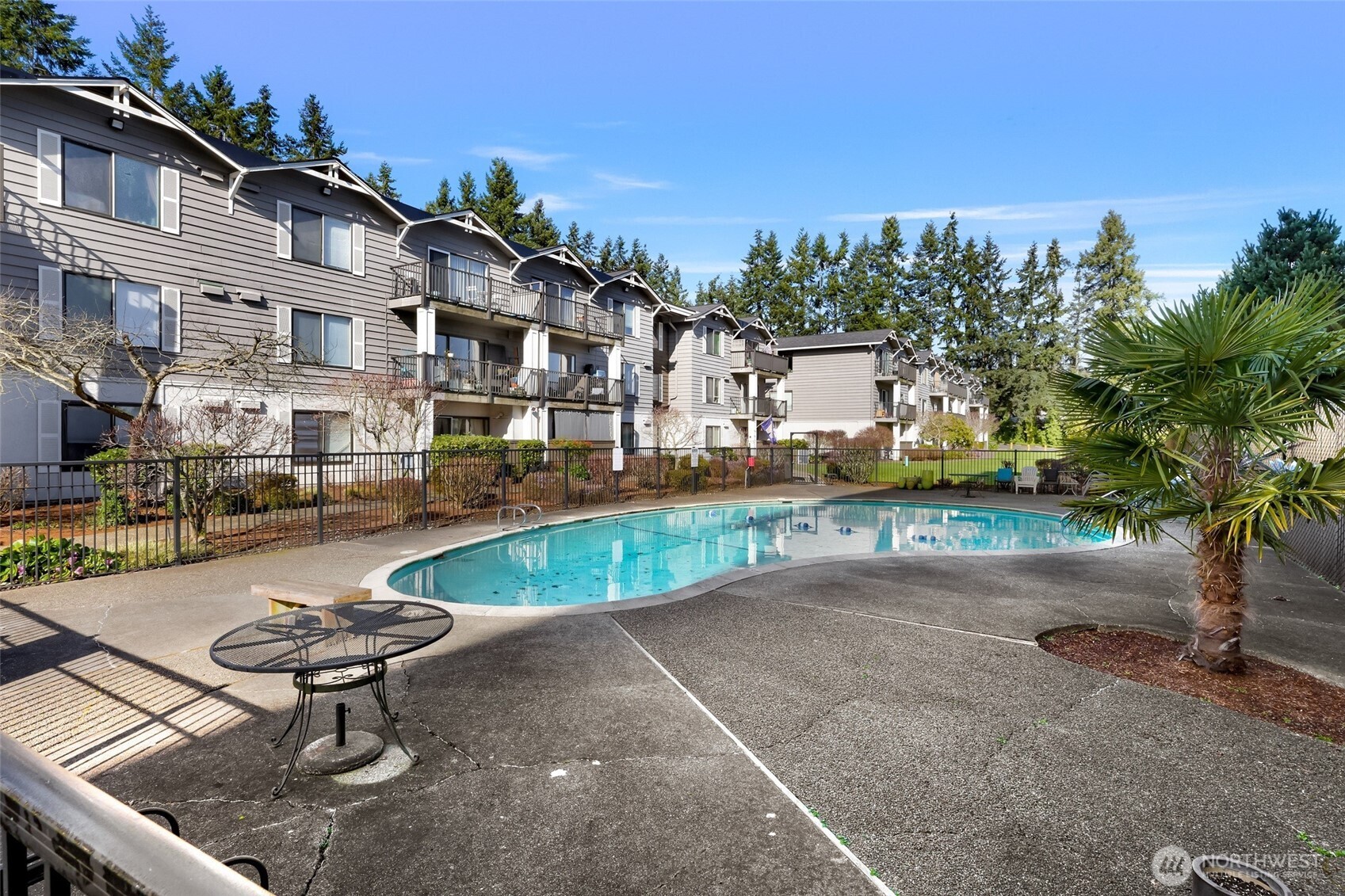 Soak up the best of both worlds—relaxation and convenience. This inviting condo features access to a community pool just in time for warmer days, offering the perfect place to unwind, recharge, and enjoy a little sunshine right at home. A grassy play area adds even more space to relax and connect.  Inside, this well-appointed 1 bed, 1 bath ground-floor unit offers 729 sq ft of comfortable living, complete with maple cabinets, tile backsplash, and a convenient in-unit laundry and pantry.   Beyond the poolside perks, you’ll love the easy, commuter-friendly location. With quick access to nearby bus lines, light rail connections, ferry routes, and major highways, getting where you need to go is simple and efficient. Secured entry, storage unit, and assigned parking.