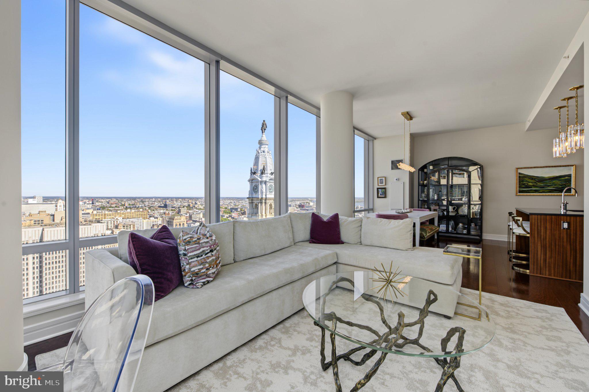 RARE HIGH FLOOR 2 BEDROOM CORNER UNIT RENTAL AT BEST ADDRESS IN THE CITY. Most sought after 2-floor layout modern apartment with the best views in Philadelphia on the 35TH floor overlooking both City Hall with the additional views of the western sunsets and skyline. Experience luxury living at its finest in this stunning corner unit, widely regarded as the most desirable 2-bedroom residence at The Residences at The Ritz-Carlton. 1 deeded parking space is included with this unit. Outdoor Resident Lounge is currently undergoing a complete renovation to include an outdoor Kitchen, multiple grilling areas and a covered loggia with an expected June completion date.  There is also a newly added Dog Park on the 2nd floor.  Indulge in the 5-Diamond hotel amenities, including concierge service, doorman, chauffeur-driven Mercedes, room service, fitness center, pool, hot tub, residents' lounge, media room, Valet Parking, and garden.  This is upscale urban living at its finest.  There are breathtaking wrap-around views of City Hall, William Penn, and the Delaware River from this contemporary 35th-floor home. Designed by Handel Architects, the residence features floor-to-ceiling windows, 10' ceilings, and new wide plank flooring. The gourmet kitchen boasts top-of-the-line appliances, all newly renovated countertops with slab backsplash. Retreat to the master suite with a luxurious ensuite bath featuring Calacatta marble and a Bain Ultra soaking tub.  With 24/7 concierge services and access to The Ritz-Carlton hotel amenities, including in-residence dining and housekeeping, this property offers the ultimate urban luxury lifestyle. Conveniently located near restaurants, shops, theaters, and major interstates, this is city living at its finest.
