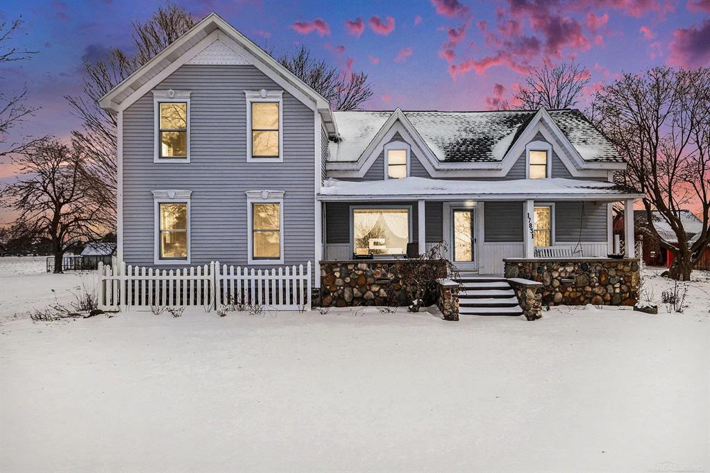 Built in 1870 and thoughtfully improved over time, this exceptional property blends authentic character with modern comfort in a way that feels both intentional and livable. Multiple updates, including a well-integrated addition, complement the original structure, creating a home that lives far more contemporary than its age suggests. With 4,420 square feet of finished living space, the home is in excellent condition, meticulously maintained, and truly move-in ready.  Set on 5 acres, the property is ideally suited for a hobby farm, homesteading, or those simply seeking space and privacy. A fully fenced 3-acre pasture offers an ideal setup for horses or livestock, while three separate barns provide flexibility for animals, equipment, storage, or workshop use. The property is serviced by two wells, including a dedicated livestock well, allowing for efficient operation of the pasture and outbuildings without impacting household use. The layout of the land supports usability and function without sacrificing the peaceful, open feel of the setting.  Inside, the home offers generous and flexible living spaces throughout, including a main-level bedroom and full bathroom, providing convenience and accessibility for guests or everyday living. The expansive primary bedroom features a large walk-in closet and additional space well suited for a sitting area, office, or private retreat. Over the garage, a massive upper-level bedroom includes a combined living area and ensuite bath, along with its own private entrance, making it ideal for guests, extended living, or multi-generational use. A small bonus room adds further versatility for hobbies, storage, or a quiet workspace.  The home is equipped with zoned geothermal heating, offering energy-efficient comfort, customized temperature control, and long-term operating savings. The finished garage incorporates barn wood sourced directly from the property, a subtle and meaningful nod to the land's history. Throughout the home, updates have been completed with care, preserving orig