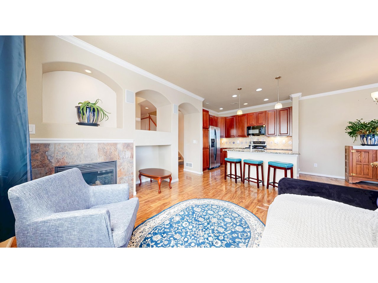 Priced for a QUICK SALE! Rare opportunity to own one of the largest corner townhomes in the community, offering 3 bedrooms, 3 bathrooms, southern exposure, abundant natural light, and a spacious, functional floor plan.The impressive primary suite features vaulted ceilings, French doors, a private balcony, cozy fireplace, and a luxurious five-piece bath. Upstairs you'll also find two additional bedrooms, a full bathroom, and a built-in office with a granite countertop, ideal for working from home.The inviting main level includes a bright family room with fireplace, breakfast nook, powder room, full laundry room with utility sink (washer and dryer included), and direct access to a private patio. The kitchen is beautiful with granite countertops, a large center island, upgraded 42-inch cherry cabinets, modern fixtures, and a new microwave. An attached two-car garage provides added convenience, while the low HOA includes water for even greater value. Located in the desirable Hometown community near Arvada and Golden, you'll enjoy easy access to trails, parks, shopping, dining, and everyday conveniences, all while being just minutes from downtown Denver.If you're looking for space, privacy, and low-maintenance living, this home checks all the boxes. Priced for a QUICK SALE, this is an exceptional value and one of the best opportunities in the neighborhood. Be sure to view the property video and Matterport 3D tour for a complete look inside!