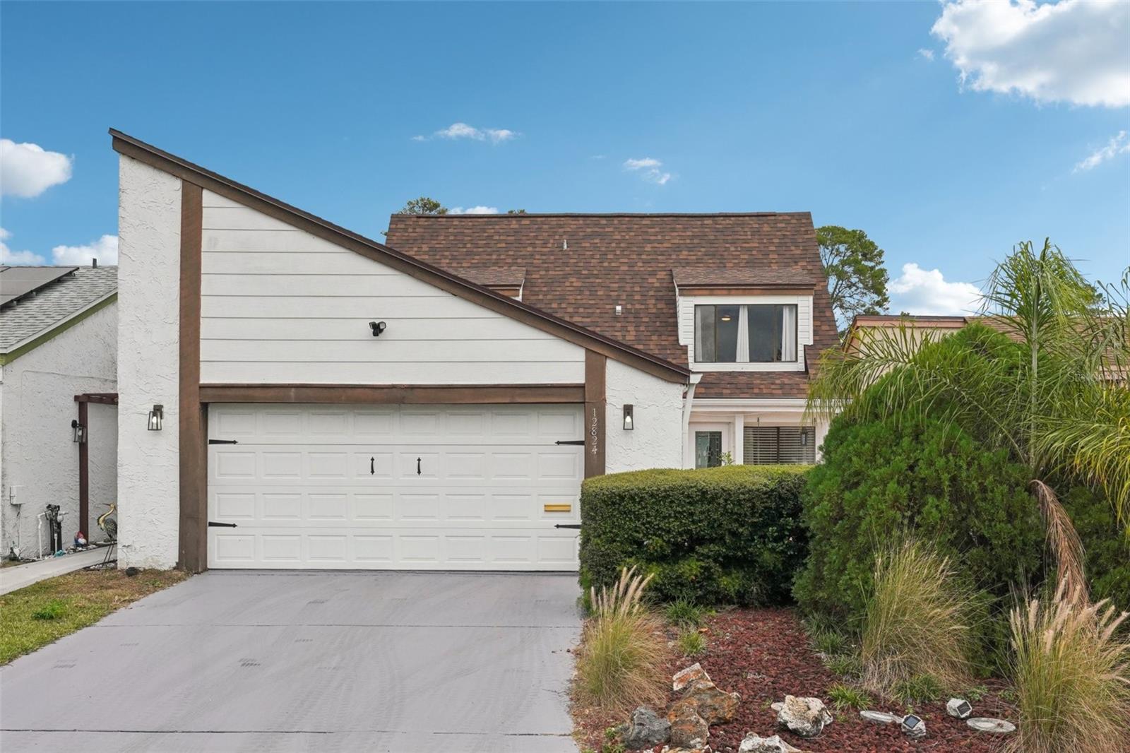 Charming Pool Home Just 3.5 Miles From Hudson Beach located in an X-Flood Zone, this beautifully maintained 3-bedroom, 2.5-bath single-family home is the perfect place to settle in and make your own. Even better come assume this incredible 4.5 interest rate! This home offers a wonderful blend of vintage character and modern upgrades. Recent improvements include new vinyl flooring, a remodeled primary bathroom with modern stylish tile floors, new staircase, and fresh interior paint throughout. Major updates are already complete with a NEW roof, NEW water heater, NEW gutters, NEW ceiling fans throughout and lanai, New Drywall ceiling in garage, New Garage door opener with remote access and keyless entry access. The pool pump is approximately 2 years old, giving peace of mind for years to come. As you step through the elegant double doors, you're greeted by a bright family and dining room combo with full views of the sparkling pool and spacious backyard. The home features a unique focal-point atrium, filling the interior with natural light and creating an inviting, open atmosphere. The conveniently located half bathroom sits near the entrance. The kitchen is positioned to the left and flows perfectly toward the sliding doors and outdoor space. The primary suite is on the first floor, offering privacy and comfort, complete with a beautifully remodeled bathroom featuring an elegant garden tub. Upstairs, you’ll find two generously sized bedrooms and a full bathroom showcasing charming vintage tile. The bedroom to the left includes an air handler inside the closet, yet still offers plenty of space to add an armoire or wardrobe if desired. With so many upgrades already completed, there’s still room for your personal touches and creativity. This home truly offers the perfect balance of style, comfort, and potential. Come schedule a private tour because this is a RARE FIND.