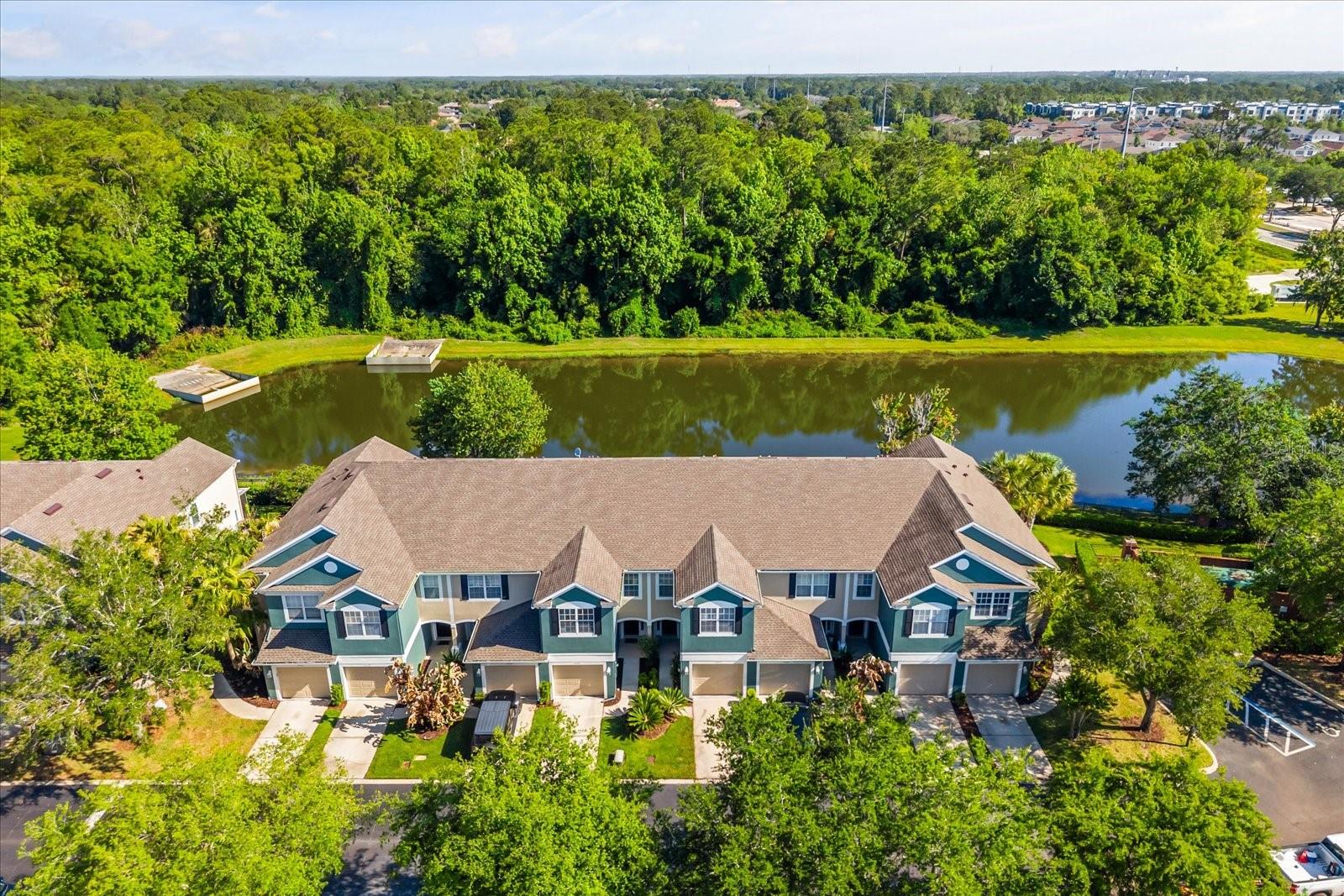 Located in a desirable Sanford community, this stunning townhome offers a scenic water-view setting within a well-maintained neighborhood, combining natural beauty with everyday convenience. Overlooking tranquil pond views and surrounded by lush landscaping, the community provides a peaceful, resort-style atmosphere highlighted by a beautifully maintained pool area and thoughtfully designed outdoor spaces. The home itself features a clean townhome-style exterior with a private garage and strong curb appeal, positioned to take full advantage of its serene surroundings while remaining just minutes from major roadways, shopping, dining, and top-rated Seminole County schools.Inside, the property showcases a bright and expansive open-concept layout featuring BRAND NEW FLOORING, BRAND NEW PAINT, seamlessly connecting the kitchen, living, and dining areas to create an ideal space for both everyday living and entertaining. The kitchen offers ample cabinetry, generous counter space, all overlooking the main living area for enhanced functionality and flow. Updated flooring and neutral finishes extend throughout, creating a clean, modern feel, while the spacious living and dining areas are filled with natural light and open to a screened-in patio through sliding glass doors, providing a smooth transition between indoor and outdoor living.The bedrooms are spacious, bright, and designed for comfort, with large windows that bring in abundant natural light. The primary suite serves as a relaxing retreat, featuring a generous layout complemented by peaceful water views, adding a unique and desirable touch rarely found in similar properties. The bathrooms offering a full tub and shower combination along with well-maintained fixtures and practical design that supports everyday convenience. A/C replaced in 2024! With its combination of water views, open living spaces, brand new flooring and paint, resort-style amenities, and a highly desirable location, this property presents an excellent opportunity for buyers seeking comfort, functionality, and long-term value!