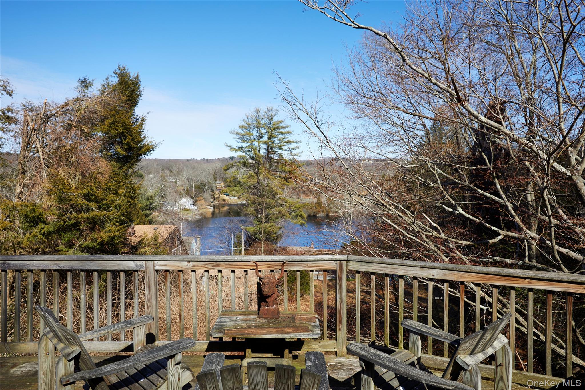 New professional photos!! — this property is no longer limited to cash buyers. Qualified purchasers may obtain financing with proper documentation, making this an even more accessible and attractive opportunity.The main level features an open-concept layout highlighted by a large bay window that fills the space with natural light. Sliding glass doors lead out to a deck overlooking Lake Truesdale, creating a seamless indoor-outdoor flow. The spacious kitchen opens directly into the dining area and living room, anchored by a well-positioned fireplace. This level also offers flexibility with potential for a fourth bedroom or home office.Upstairs, you’ll find three bedrooms and a full bath, along with ample storage throughout.Whether you’re looking to renovate, invest, or build equity, this is a chance to get into a great location with flexibility on purchase options. Don’t miss out!This property is a true blank canvas. Whether you're looking to make thoughtful updates or pursue a full renovation, the layout and location create an excellent opportunity to add value in a desirable waterfront community. The home needs updating but offers strong upside for the right buyerCash preferred not required. Time is of the essence