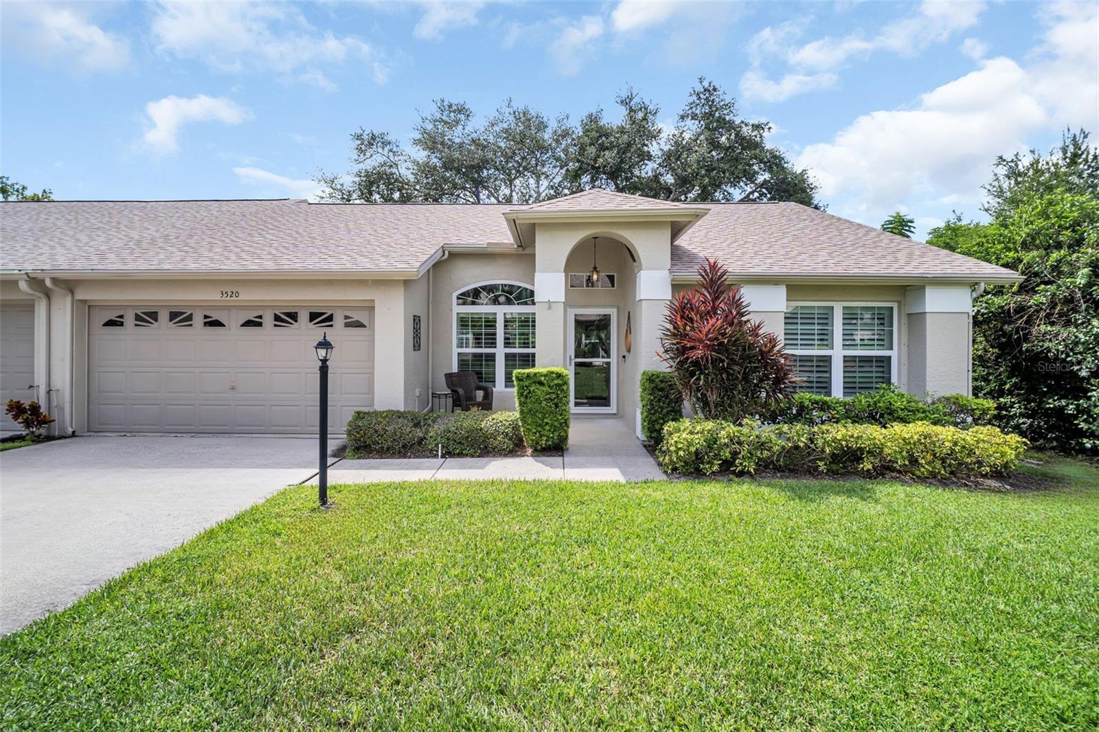 Stunning and truly one-of-a-kind, this beautifully remodeled conservation-view villa offers nearly 1,600 square feet of open-concept living in the sought-after Nature’s Cove neighborhood of Highland Lakes—Palm Harbor’s premier 55+ golf community. Enjoy soaring vaulted ceilings in every room, abundant natural light, and peaceful nature views from nearly every window. The show-stopping kitchen opens to the breakfast nook and family room, all framed by view-worthy sliding doors that lead to a private back patio. The kitchen is a dream, featuring granite countertops, sleek stainless steel appliances, solid wood cabinetry with under-cabinet lighting, recessed lighting, and a breakfast bar for casual dining. The spacious master suite offers serene private views, generous closets, a double vanity, and a tiled walk-in shower. High-end finishes include newer luxury vinyl plank flooring throughout, upgraded fixtures, and modern materials. Additional highlights include an indoor laundry room, a 2-car garage, a full driveway, and walking distance to Lake Tarpon Lodge with lake access. Recent upgrades provide peace of mind, including a NEW roof (2023), HVAC system (2020), water softener (2023), updated Simonton windows (2017), electric storm panels & manual shutters (2022), and water heater (2018). This home is high and dry in a non-flood zone and has just passed a 4-point insurance inspection—report available upon request. Nature’s Cove is the newest villa section in Highland Lakes, and residents enjoy low-maintenance living with a monthly fee of just $205 that covers lawn care, irrigation system maintenance, exterior painting, pressure washing, cable TV, internet, trash, and recycling. Highland Lakes offers a vibrant and active lifestyle, with free unlimited golf on three private executive courses, free RV or boat storage, tennis and pickleball courts, a large clubhouse with frequent entertainment and social events, and a wide variety of fitness, hobby, and arts programs. The Lake Tarpon Lodge features a second heated pool, picnic areas, a fishing pier, community pontoon boats, and a private boat ramp. Located in a high and secure area outside the flood hazard zone, this community offers unmatched convenience—just minutes from award-winning Gulf beaches, top-tier shopping and dining, professional sports venues, cultural attractions, top-rated medical facilities, and two international airports. This exceptional home is move-in ready—are you ready for the best of your life?