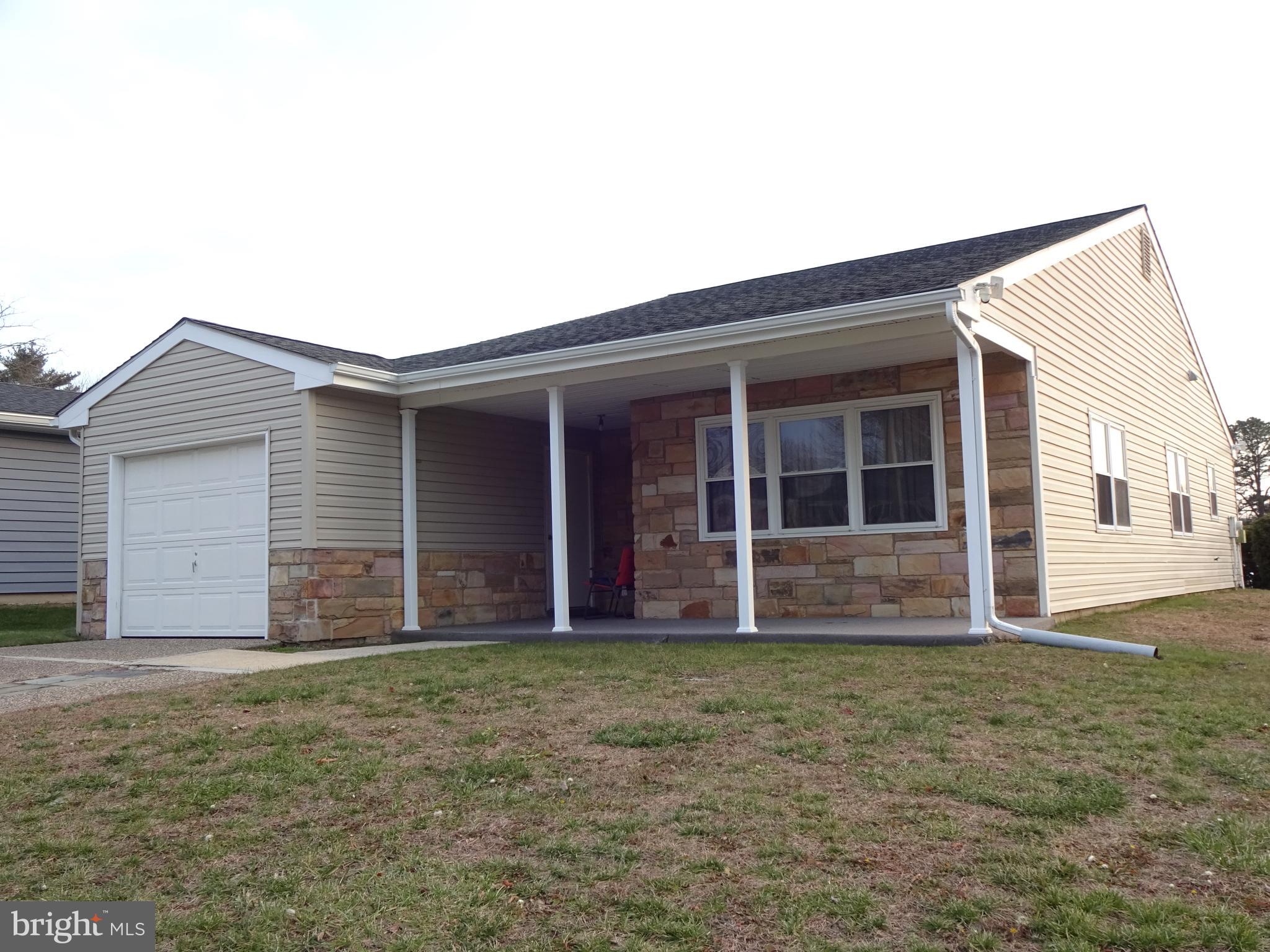 Welcome to this Spacious Haverford model.  You will be greeted by the Covered Front Porch that you'll enjoy in our balmy weather, and, will protect you on rainy days.  This popular style home's room sizes are amazing for comfortable living.    The Living Room is quite spacious!  The Dining Room is currently used as an Office,  but, will easily accommodate family or friend's gatherings for dining.  The Kitchen has been enlarged for more storage including a pantry.  Although there's ample counter space, an Island can easily be added if you like.  The spacious Primary Bedroom EnSuite includes a Walk-In Closet and Full Bath with a Stall Shower.  Bedroom 2 is also a nice size, conveniently located steps away from the Hall Bath w/Tub for your overnight guests.  Both Bath's Vanities have drawers for your convenience.  This comfortable home has many upgrades that the Sellers have done gradually since they purchased in 2012:  Vinyl Siding,  efficient Lennox Heat pump installed in 2020 (current unit replaced in 2024), Gutters were replaced,  HWH was replaced, and Washer/Dryer were replaced.  This home has so much potential to make it your own.  It's being sold in "As Is" condition including the Sprinkler's system which Seller's have  never used!  The Sellers are currently involved in a Contingent purchase.