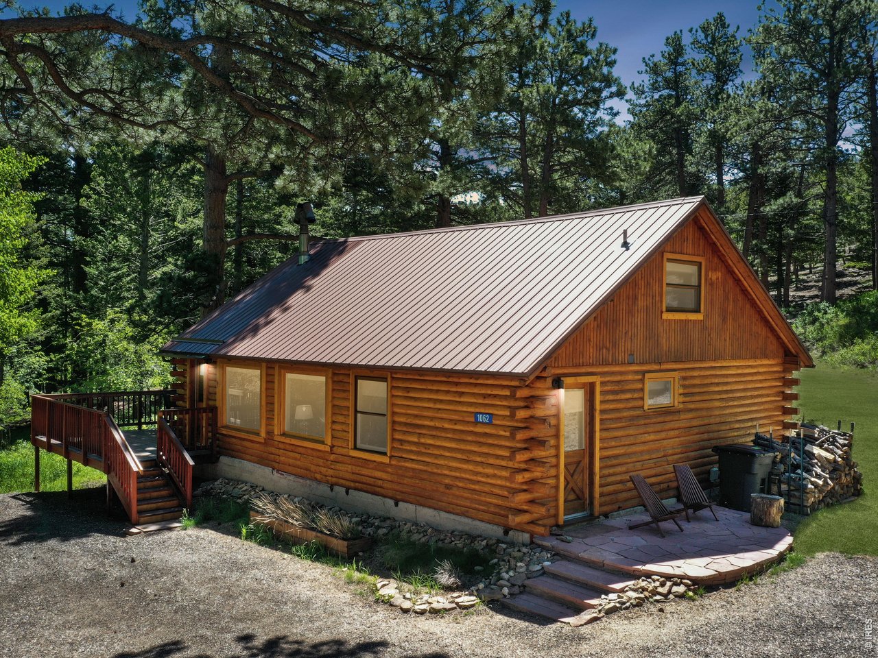 This is your Log Cabin in the woods! Forested 1.19 acre lot with abundant Evergreens, Aspen and Wildlife. Open floor plan features a vaulted greatroom with warm woodstove, updated kitchen, 3 bedrooms , 1 bath, plus a storage loft. Updated throughout, with newer wood windows, knotty pine doors & trim, luxury vinyl flooring, laundry, interior paint, plumbing, refrigerator, well pressure tank, gutters & 200 amp electric service. Beautifully restored log exterior and inviting outdoor areas to enjoy the mountain views and shimmering aspen. Just minutes to Town, Mary's Lake & Rocky Mountain National Park. Furnishings negotiable. Ideal year round living or a weekend getaway, this is the one you've been waiting for...