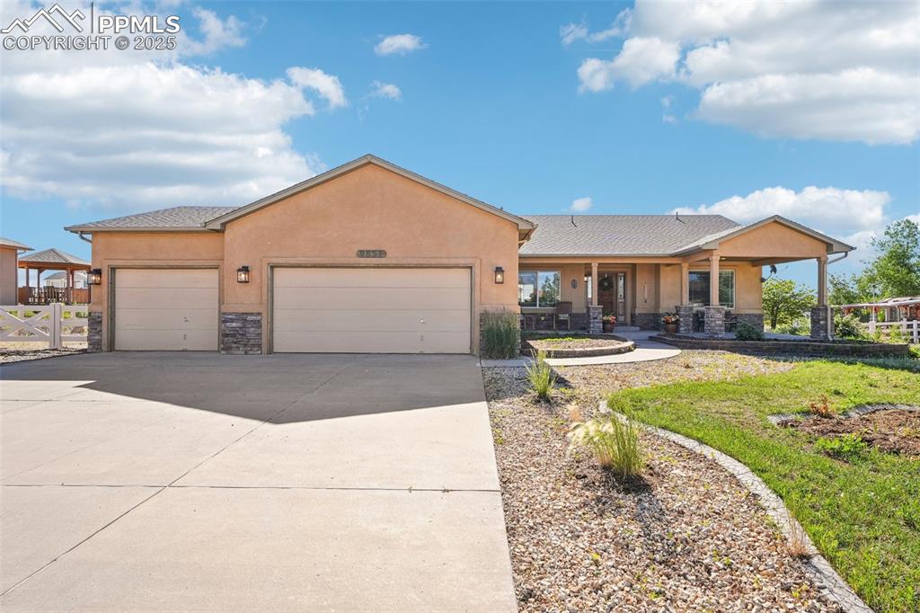 Welcome to this truly impressive ranch-style retreat in the heart of Peyton’s Paint Brush Hills. Built in 2006 on nearly half an acre, this charming home merges spaciousness, modern comforts, and versatile living in one inviting package. Enter to the open-concept main floor that connects a bright, updated kitchen to both formal and casual dining areas and a light, bright living room. On one side of the main level is your private oasis, a lavish master suite featuring a 5-piece bath and a custom walk-in closet. On the opposite end are two bedrooms and a full bath. Downstairs, an expansive finished basement boasts a massive family room with wet bar, three additional bedrooms, and full bath— catering to game nights, guests, or a home theater (the chairs are already included!). The oversized 3-car garage has an EV charger and extra storage room. Outdoor amenities include a spacious enclosed back patio with 220-volt service and room for RV parking. A detached 450-sf workshop/garage provides space for crafts, hobbies, or even more storage—an exceptional bonus.