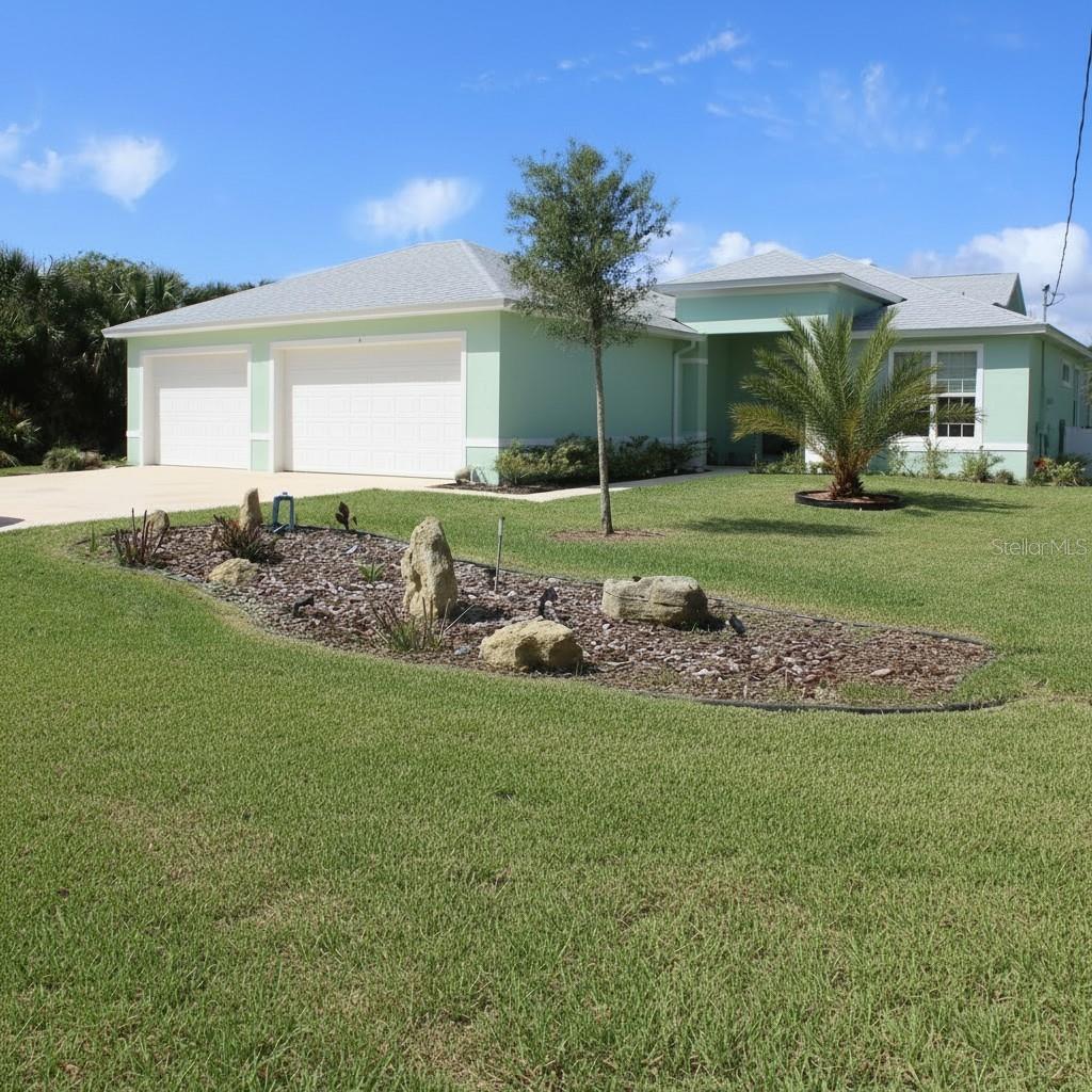 Welcome to this stunning modern coastal retreat located in the highly desirable beachside community of Hammock in Palm Coast. Built in 2023, this beautifully designed home offers the perfect blend of luxury, privacy, and coastal convenience. Just a short walk or golf cart ride to the beach. This spacious residence features 3 bedrooms, 2.5 bathrooms, and over 3,300 square feet of thoughtfully designed living space, all set on an oversized 0.254-acre lot—larger than most in the area. Inside, you’ll find an open-concept floor plan with soaring 10-foot ceilings and an abundance of natural light. The designer kitchen serves as the heart of the home, complete with granite countertops, a large center island, and stainless steel appliances perfect for entertaining or everyday living. The primary suite offers a true spa-like retreat, featuring a built-in closet system, dual vanities, a private water closet, and an oversized walk-in shower with bench seating. A split-bedroom layout enhances privacy, with guest bedrooms connected by a Jack-and-Jill bathroom, plus an additional half bath for convenience. Luxury vinyl plank flooring runs throughout the home, combining durability with modern style. Step outside to your covered lanai, ideal for indoor-outdoor living, relaxing with ocean breezes, or hosting sunset gatherings. The backyard is fully fenced and includes a private pool, with additional space to accommodate a large RV or boat. Outdoor kitchen hookups are already in place, offering even more potential for customization. Additional highlights include: Extra-wide driveway and 3-car garage, Well and public water systems, No HOA providing flexibility for short-term rentals or Airbnb opportunities, Boat ramp at the end of the street, and ample trailer parking nearby, Walking distance to Publix and local conveniences. Located just minutes from the Atlantic Ocean, scenic A1A, the Intracoastal Waterway, and nearby nature preserves, this home offers a peaceful, low-density coastal lifestyle far from the congestion of inland developments. Whether you're looking for a primary residence, a vacation getaway, or a high-performing income property (with potential to accommodate large groups), this home delivers exceptional versatility and value.