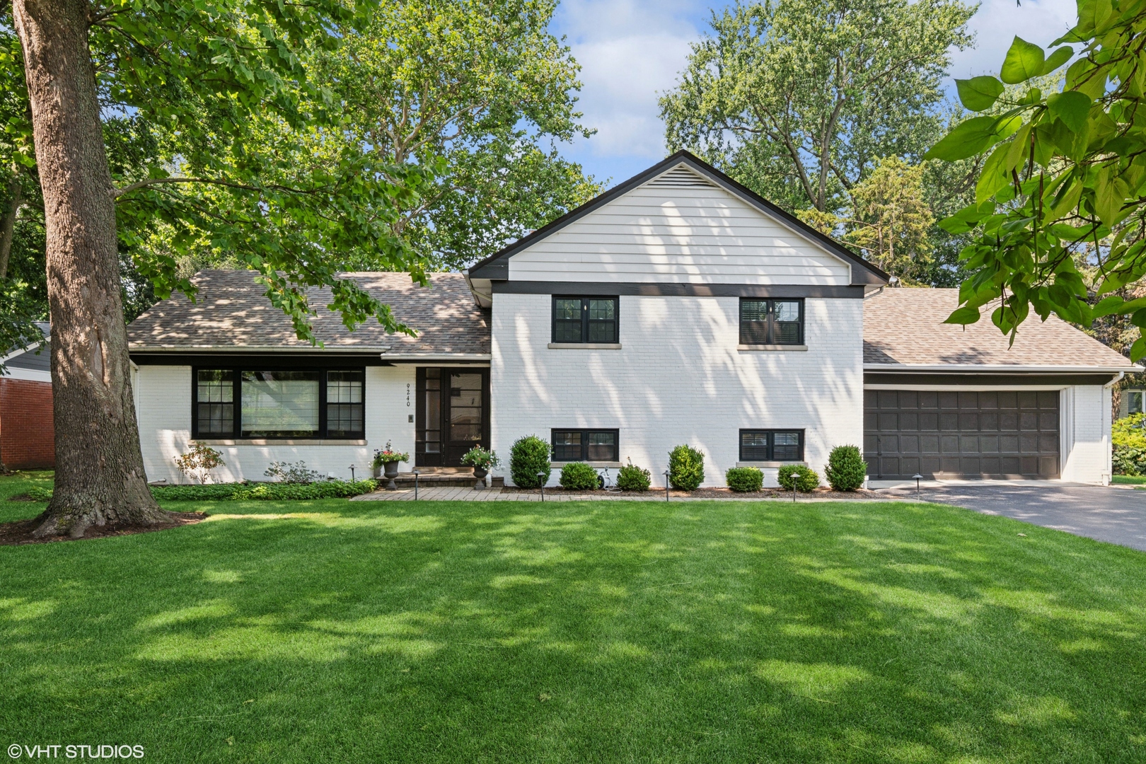 Welcome to 9240 Avers Avenue, a beautifully updated Hemphill-built split-level brick home tucked away in a peaceful pocket on one of Evanston's most sought-after streets on an enormous 1/4 acre lot. This timeless residence offers the perfect combination of classic mid-century charm and thoughtful modern updates, featuring four generously sized bedrooms, two full bathrooms with a great layout and flow to one of Evanston's premier private backyard oasis's. The main living room is the heart of the home, where the dining area, kitchen and stairs up to the bedrooms and down to the family room, all meet and connect! The beautifully updated kitchen boasts modern appliances, quartz counter tops, ample modern shaker style cabinetry. Upstairs, you'll find 3 bedrooms with hardwood flooring, closet space, all surrounding the level's very tastefully updated full bathroom. Downstairs, a large family room/ flex space/ is accompanied by a statement fireplace and has a dedicated fully enclosed 4th bedroom adjacent to the perfect guest/2nd full bath. A fully finished and professionally water proofed sub-basement adds another tremendous amount of space, ideal for playroom, rec room, fitness space, etc. One of the standout features of this home is its connection to the serene and lush outdoors- the oversized sliding doors off the dining room lead to this enormous private oasis equipped with a patio and expansive, fenced in backyard. The home also includes a spacious two-car attached garage and a classic brick exterior. Located within the highly rated Walker Elementary, Chute Middle, and Evanston Township High School districts, and just minutes from parks, local shopping, and dining, this home offers the perfect balance of suburban tranquility and convenient access to everything Evanston and the North Shore have to offer.