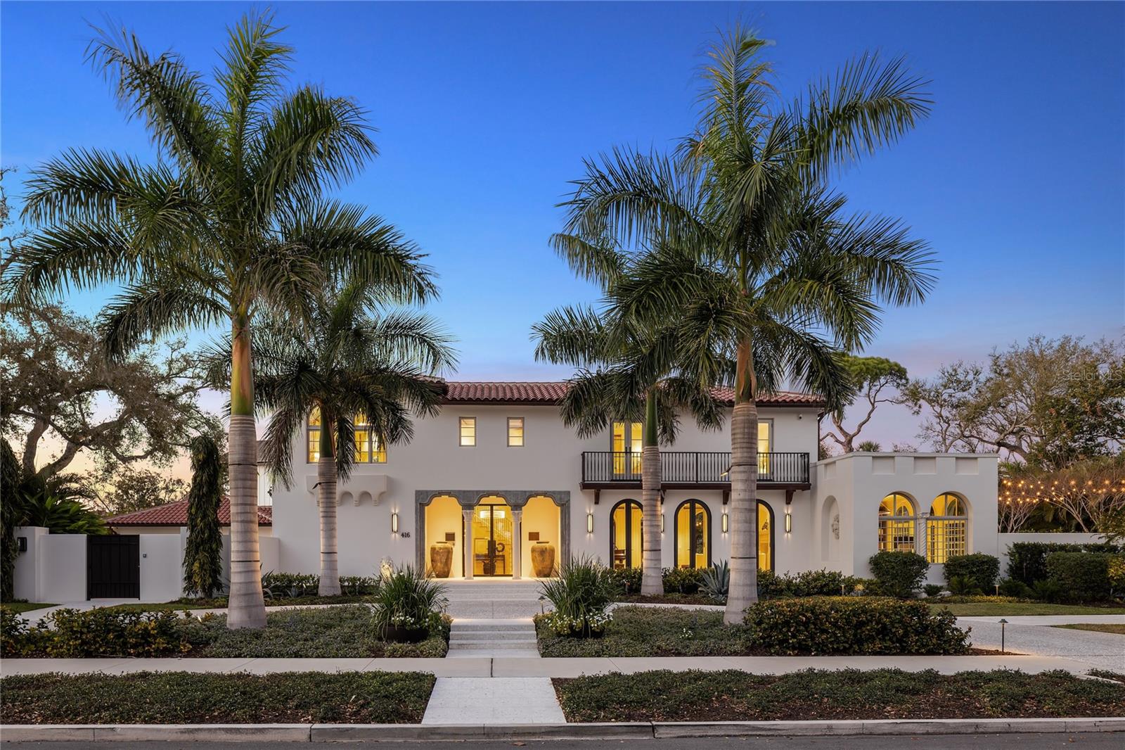 Brightleaf is a rare and significant Snell Isle estate, originally designed in 1925 by renowned firm Kiehnel & Elliott whose legacy is woven through the finest Mediterranean Revival estates of Florida's golden era, and built by master builder S.V. Schooley. Following a comprehensive four-year renovation by architect Greg Jones and builder Carmine Pici of Tom Pici and Son, the home has been fully reengineered with all new mechanical, electrical, plumbing, and climate systems - so extensive it is classified by insurance as 2024 new construction. Privately set behind a gated drive and separate pedestrian entrances, seamlessly integrated into a 7-foot perimeter privacy wall, the property offers exceptional security and seclusion. Landscape architect Michael Gilkey reimagined the grounds in their entirety, creating a cohesive and refined outdoor environment that complements the home’s architecture. The estate spans 6065 square feet and includes 5 bedrooms, 5.5 baths, and a detached guest house designed to the same exacting standards as the main residence. The guest house features a private entrance, kitchen with premium appliances, dedicated living space, bedroom, and bath - ideal for extended stays, multigenerational living, or private guest accommodations. Interior spaces, designed by Jaime Rogers with Doxa Home, are defined by timeless materials and exceptional craftsmanship, including large-format Turkish limestone flooring throughout the main living areas and rift-cut white oak extending through the kitchen, upper level, and guest house. Custom cabinetry by Michael Bright and T2theS showcases precision joinery and clean, modern lines, while curated lighting selections elevate each space. The main kitchen is fully appointed with Wolf, Sub-Zero, Miele, and Cove appliances, complemented by reverse osmosis water filtration systems at every draw in both the main residence and guest house. Outdoor living is centered around a resort-style zero-edge infinity pool with an advanced ozone purification system, creating a pristine and low-maintenance environment. The home is equally impressive in its infrastructure, featuring a 60kW Generac whole-house generator, four independent HVAC systems, three tankless water heaters, foam insulation beneath all rooflines, and integrated whole-property audio/visual systems. The renovation encompassed every aspect of the estate, including a new roof, impact-rated windows and doors, three dramatic bifold openings, updated water management systems, a new mechanical room, wellness studio/gym, and a spacious two-car garage. All exterior elements including the pool, driveways, and walkways were newly constructed. Situated on an expansive 27,743 square foot lot, one of the largest on Snell Isle, the property offers an unmatched sense of scale, privacy, and presence. Brightleaf represents a convergence of historic architectural pedigree and modern construction, offering a fully reimagined estate in one of St. Petersburg’s most prestigious neighborhoods.