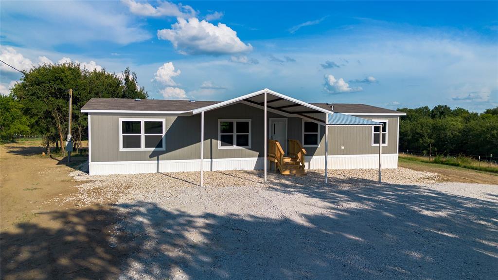 Come enjoy the quiet and comfort of the country in this brand new 4-bedroom, 2-bath mobile home set on approximately 5.32 beautiful acres. This spacious home offers an open layout perfect for families, with plenty of room to spread out and enjoy peaceful rural life. Relax and enjoy your morning coffee or unwind in the evening while over looking the beautiful view of the back yard. The land is partially wooded, offering a balance of open space and natural privacy. The property includes a convenient circle driveway, and utilities are already in place—electricity, water, and septic are installed and ready to go. Whether you’re looking for a place to raise a family, enjoy nature, or escape the city, this home is move-in ready and full of potential.