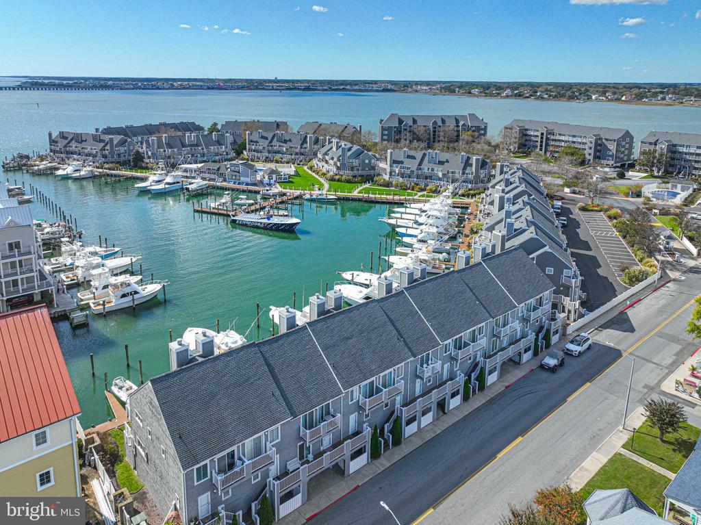 Coastal Living Awaits You in Ocean City, Maryland!  HARBOUR ISLAND IS WAITING FOR YOU! Step into your dream getaway with this completely updated coastal-style condominium, perfectly designed for relaxation and enjoyment. This stunning two-bedroom, two-and-a-half-bath unit offers a blend of modern elegance and beach-side charm, making it the ideal retreat for anyone looking to embrace the vibrant Ocean City lifestyle.The Interior Highlights include: Fully renovated kitchen.   Enjoy cooking in your state-of-the-art kitchen featuring stainless steel appliances, gorgeous quartz countertops, and abundant cabinetry that provides ample storage.  Enjoy the spacious layout.... the open floor plan is enhanced by new luxury vinyl plank flooring that effortlessly combines style and durability, making it perfect for beach living.  Many finishing touches  that are thoughtful design elements adding  a touch of sophistication and comfort.There is additional storage space in the garage underneath of the unit and a storage closet that stays locked as well for anything that you may need to place there for safekeeping. Harbour Island is home to the 52 yr old... Worlds Largest Billfishing Tournament!"   This could be right out your back door for 1 week in August each year!!   So exciting and a huge event for Ocean City! **Outdoor and Community Amenities:** - **Boat Slip Access**: A rare gem—you too could own the boat slip out the rear of  the unit- sold separately for $150,000.   Size is 12 x 38, could hold a possibly a 40 ft vessel. Imagine the convenience of easily parking your boat right here, or even renting it out for additional income for WMO.  If you need some extra room for guests, they could sleep peacefully right on your boat!!  - **Harbour Island Community**: Take advantage of the outdoor pool,  or the Reel Inn Restaurant which is perfect for summer relaxation or entertaining friends and family. **Location, Location, Location:**- **Proximity to the Beach**: A short stroll takes you up to the beach, where you can soak up the sun, enjoy the waves, and create lasting summer memories.  Explore a variety of nearby restaurants and shops, catering to all tastes and preferences. Whether you’re a fishing enthusiast or simply love the beach atmosphere, this location has it all!This beautifully renovated condominium is not just a home; it’s a lifestyle waiting for you to embrace. Don’t miss the chance to own this piece of paradise in Ocean City—schedule your viewing today and experience coastal living at its finest!    Here you will have a front row seat to the largest White Marlin Tournament on the East Coast!!