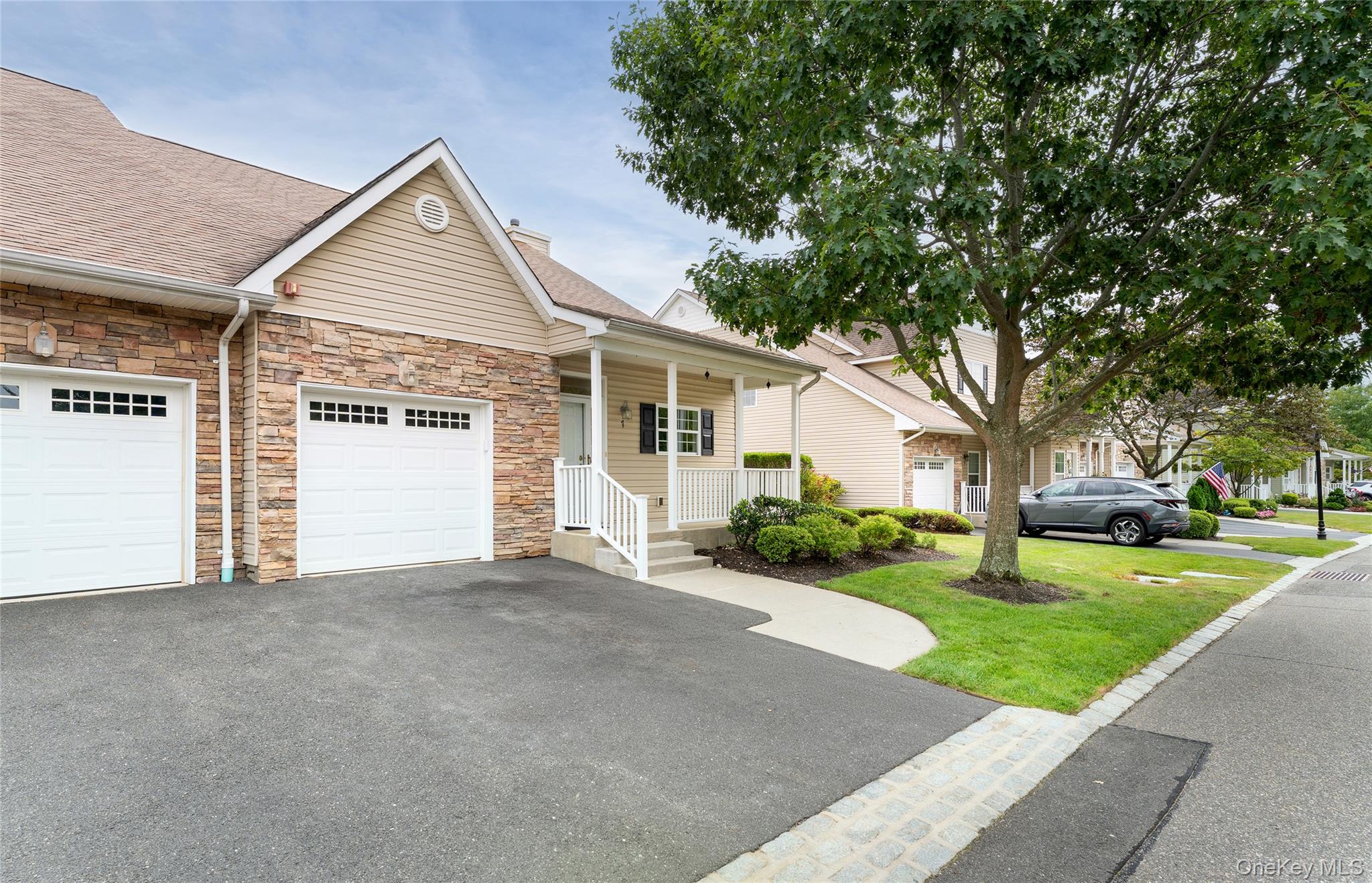 Welcome to Plymouth Estates a Gated 24Hr Community offering a range of Amenities. This is the "Ashby" Model Ranch Style End Unit with no one above in a great location close to the Clubhouse and Pool. This model features an Open Concept Design with Cathedral Ceilings, Gas Fireplace, Freshly Painted and New Carpeting. The Bright Kitchen features Stainless Steel Appliances, Granite countertops and Rich Cherry Cabinets opening seamlessly to the living and dining areas. The Primary Bedroom is a Private retreat complete with dramatic ceilings a walk-in-closet and your own en-suite bath complete with a walk-in shower. Step outside to your Private Patio the perfect spot for BBQ, morning coffee or simply relaxing. On the Lower Level is a 1294sq ft Basement that is partly finished  complete with a Bath. Amenities include a Clubhouse, Heated Pool, Tennis, Pickleball, Shuffleboard, Bocce, Putting Green plus included in your maintenance is Cable, Internet, Snow Removal, Landscaping and Grounds Care. Don't miss this Opportunity to enjoy living in one of Mount Sinai's most sought after communities!