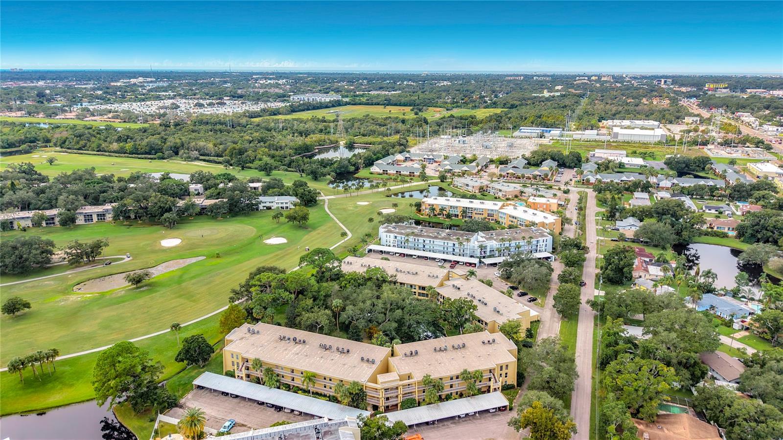 JUST LISTED! BEAUTIFULLY UPDATED 3-BEDROOM CONDO WITH SPECTACULAR GOLF COURSE & GARDEN VIEWS!225 Country Club Drive E #252, Largo, FL 33771Offered at $333,000 | 3 Bedrooms | 2 Bathrooms | 1,820 Sq. Ft.SPACE, STYLE & SCENIC VIEWS! Discover an exceptional opportunity at Penthouse Greens Condominium, a friendly and social community offering comfortable Florida living in a peaceful, beautifully landscaped setting. This spacious, completely updated 3-bedroom, 2-bath residence offers approximately 1,820 square feet, an unusually generous floor plan, assigned covered parking, and memorable views of the East Bay Golf Club and tranquil garden pond.Step inside to discover a refreshed interior featuring luxury vinyl plank flooring throughout the main living areas, plush new carpeting in the 2 of the bedrooms, remote-controlled drapes, and new ceiling fans throughout. The updated kitchen showcases quartz countertops, double stainless-steel sinks, upgraded cabinetry, a glass-top electric range, dishwasher, refrigerator, and a separate enclosed pantry. A dedicated in-unit laundry and utility room includes a washer and dryer, convenient water heater access, and an air-conditioning system replaced in 2020.A RARELY FOUND, VERSATILE BEDROOM LAYOUT! Two exceptionally spacious bedrooms measure approximately 12' x 21' and 11' x 23'. Both have walk-in closets, adjoining upgraded bathrooms, and unobstructed views of the East Bay Golf Club. The flexible arrangement provides excellent possibilities for a primary bedroom suite, guest accommodations, or simply enjoying the luxury of extra space. Both bathrooms feature tiled walls, stylish lux fixtures, and a modern glass shower enclosure. The third bedroom, approximately 11' x 14', is ideal for guests, a home office, hobby room, or fitness space.The expansive 14' x 21' living room flows into an adjoining sitting room, creating inviting spaces for entertaining or unwinding at the end of the day. Enjoy peaceful views of the lush landscaped gardens and pond, where birds and local wildlife add to the serene atmosphere. The separate 11' x 11' dining room, highlighted by an elegant crystal chandelier, offers lovely garden views through sliding glass doors.GOLF COURSE VIEWS ON ONE SIDE, PEACEFUL GARDEN VIEWS ON THE OTHER! Golf enthusiasts will appreciate the unobstructed vistas of East Bay Golf Club, a popular public course featuring an 18-hole, par-71 layout. Whether enjoying your morning coffee, entertaining friends, or relaxing at home, the beautiful surroundings make this residence especially appealing.Built in 1972, Penthouse Greens is an established condominium community featuring 11 three-story buildings, a swimming pool, and a clubhouse. The welcoming atmosphere encourages an enjoyable, social lifestyle, while the convenient Largo location places shopping, dining, medical facilities, and everyday necessities within easy reach.Monthly condominium maintenance fee: $606.34, covering cable TV, internet, pool maintenance, pest control, sewer, trash, and water. Assigned covered parking adds everyday convenience.SPACIOUS. UPDATED. PEACEFUL. If you have been searching for a move-in-ready condo with generous living space, flexible bedroom options, covered parking, and outstanding golf course and garden views, this Penthouse Greens residence deserves your attention.NEW TO MARKET — $333,000! Discover the space, comfort, and scenic surroundings that make this condo such a special opportunity!
