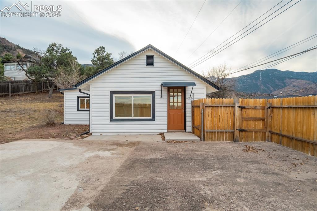 Charming and cozy 3-bedroom, 1-bath home in Manitou Springs featuring an oversized 2-car garage plus two additional designated parking spaces right by the front door. Enjoy beautiful views of Garden of the Gods and the surrounding mountains.