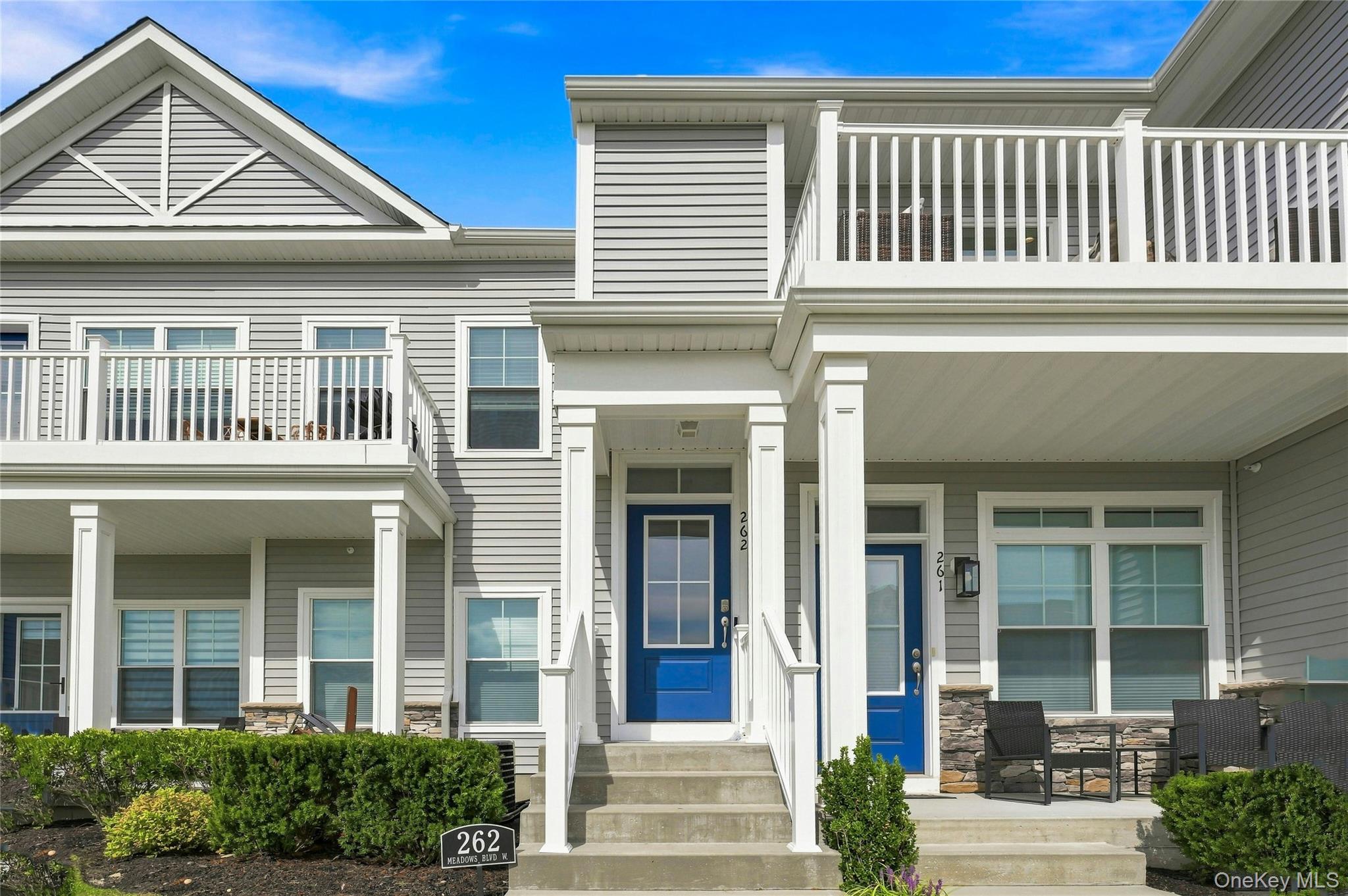 Welcome to this beautifully appointed second-floor condominium located in a desirable gated 55+ community in Yaphank. Designed for both comfort and entertaining, this spacious residence offers an open-concept floor plan enhanced by dramatic 14-foot vaulted ceilings, abundant natural light, and two outdoor living spaces—one at ground level and another off the second floor—providing plenty of opportunities to relax and enjoy the outdoors.The inviting chef’s kitchen is the heart of the home, featuring elegant quartz countertops, a center island with unique hanging pendant lighting, and stainless-steel appliances. The open layout flows seamlessly into the living and dining areas, creating an ideal space for everyday living and entertaining.The spacious primary suite offers a peaceful retreat complete with a walk-in closet and private en-suite bath. A generously sized second bedroom features access to a full bath with two separate entry doors, offering convenience and flexibility for residents and guests.Additional highlights include an attic providing valuable storage space and a one-car garage with convenient front and rear access. An elevator provides easy access to the second-floor residence.Beyond your front door, enjoy an exceptional array of resort-style amenities. The community's impressive 11,000-square-foot clubhouse features a state-of-the-art fitness center, yoga studio, lounge with bar and fireplace, ballroom, card room, sauna, and steam room. Outdoor amenities include two heated swimming pools, including an adults-only pool, cabanas, an outdoor bar and lounge with TVs, fire pits, barbecue areas, tennis courts, pickleball courts, bocce courts and 2 dog parks!With its gated 55+ lifestyle, exceptional amenities, thoughtful interior design, outdoor living spaces, low taxes, and convenient proximity to shopping and everyday necessities, this Yaphank condominium offers the perfect combination of comfort, convenience, and resort-style living. Come experience all this exceptional home and community have to offer!