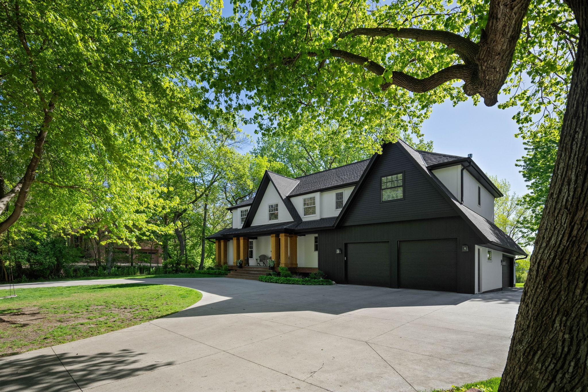 Tucked within one of the most charming pockets near Lake Minnetonka, this thoughtfully reimagined residence by City Homes blends timeless design with an effortless lake lifestyle. Set on a breathtaking 2+ acre homesite, the property offers an exceptionally rare combination of wide-open usable green space and the serenity of protected wetlands beyond — creating a private backdrop that feels worlds away. The expansive flat backyard is ideal for entertaining, recreation, future pool potential, or simply enjoying peaceful evenings surrounded by nature.Adding to the allure, the home includes a deeded boat slip on Libbs Lake, which feeds into Lake Minnetonka, just steps from the front door, delivering seamless access to lake days all summer long. The neighborhood evokes the feel of a quiet, tucked-away lake community with picturesque streets perfect for morning walks, evening bike rides, and an unmatched sense of tranquility. Despite the peaceful setting, you are only a short bike ride from the boutiques, restaurants, and lakeside charm of Wayzata’s vibrant downtown. A truly special opportunity to enjoy refined living, privacy, and the very best of the Lake Minnetonka lifestyle.