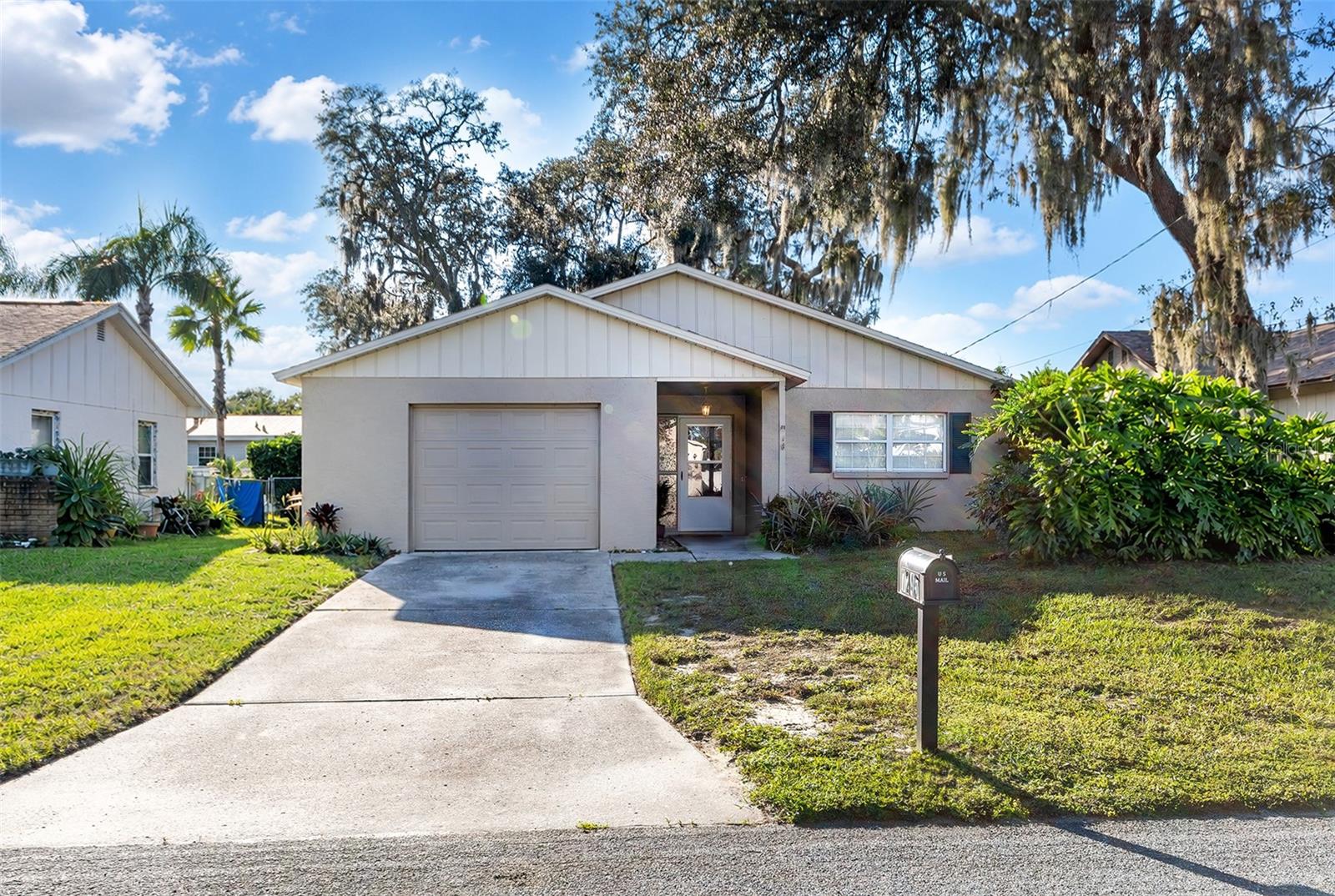 Virtually Staged. Cute, Charming & Ready to Welcome You Home! Fall in love with this adorable 2-bedroom, 2-bath home in beautiful New Port Richey! Freshly painted with brand-new flooring, this charming home is move-in ready and waiting for its next owner to make it their own.Step outside and discover the spacious, fenced backyard—a wonderful place to entertain friends, enjoy weekend barbecues, sip your morning coffee, or simply unwind in your own outdoor retreat. The inviting deck is perfect for gathering with family and friends or enjoying those lovely Florida evenings.Whether you're searching for your first home, investment opportunity, downsizing, or looking for a place to call your own, this sweet home offers comfort, charm, and plenty of potential. All that's missing is YOU! Close to the Trinity area with lots of shopping, restaurants, hospitals and easy access to the Suncoast.