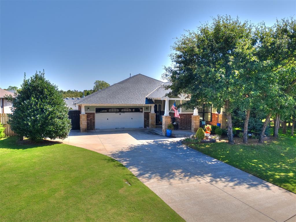Beautifully updated & decorated craftsman style home with 3 bed, 2 bath and quaint study, situated next to the community park with about 1/3 acres of lush landscaping, pavilions with seating & lending library. Experience gorgeous views from almost every room. This perfectly maintained home features a split floor plan, granite counters in bathrooms & utility, soaring 10-foot ceilings throughout, Energy Star rating, solid wood floors, custom laundry room, and home wired for audio and video (including the garage and patio). Some of the updates include NEW: blinds throughout, exterior paint 2021, Metro Quartz counters in kitchen, glass backsplash, gas range, disposal, interior & exterior light fixtures. Living room has stacked stone gas fireplace and is open to the kitchen with breakfast bar, pantry, custom drawer dividers, pull out shelving, gas range, and high efficiency LED lighting. Dining room is bathed in natural lights from windows overlooking the 1/3 acre community park. The adjacent study has double doors, window, custom built-ins and counters. It was updated with new: quartz counters, backsplash, paint, and beverage bar - top & bottom. The Primary Suite boasts a spacious bedroom, new carpet, walk-in closet with built-ins, and full bath with shower, jetted tub and double vanities. The other 2 bedrooms and full bathroom are on the SW side of the home, providing peace and privacy. Front bedroom has new matching hard wood flooring while the 3rd bedroom has new carpet. Attached 2 car garage houses the 6-person storm shelter. Discover the back patio where you can enjoy your built-in kitchen equipped with a Lynx gas grill and wine refrigerator as you enjoy the serene park. The exterior also features a storage shed, guttering, sprinkler system and extra parking behind the double gate. Located just a few minutes to I-35, shopping, restaurants, and to bike trails into Edmond and Lake Arcadia. The annual HOA Dues include a voucher for 2 annual passes to Lake Arcadia.