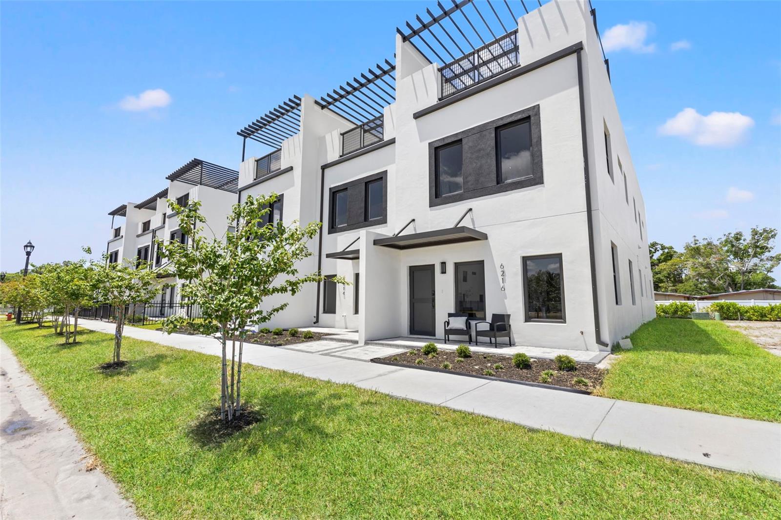 Move-In Ready Exterior Unit at Latitudes in the Park! Builder rate buy-down options are currently available through the preferred lender, with interest rates potentially as low as 3.5%, subject to buyer qualification, lender approval, and program availability. Welcome to Latitudes in the Park, an exclusive gated new-construction community offering modern design, quality construction, and low-maintenance living in the heart of Pinellas County. With only 25 residences planned at full build-out, this boutique community provides a rare combination of privacy, convenience, and long-term value. Built approximately 21 feet above the flood zone with FEMA approval, these homes were intentionally designed “high and dry,” with no flood insurance currently required. The first two floors feature solid concrete block construction, complemented by hurricane impact-rated windows and doors for added strength, efficiency, and peace of mind. This spacious exterior residence offers a thoughtfully designed three-story floor plan with 3 bedrooms, multiple living areas, a 2-car garage, private rear driveway, and an oversized private rooftop terrace. The main living level features a bright, open-concept kitchen, dining, and living area ideal for both everyday living and entertaining. The second floor includes the primary suite with a spacious bathroom and walk-in closet, along with two additional bedrooms. The third-floor loft with half bath opens directly to the expansive rooftop terrace, creating an exceptional private outdoor living space. The home is complete and move-in ready, while still offering buyers the opportunity to personalize it with a variety of builder upgrade options, including an outdoor rooftop kitchen, elevator, custom closet build-outs, epoxy garage flooring, EV charger, upgraded shower enclosures, window treatments, appliances, and more.The community pool is complete, and the HOA provides low-maintenance living with services including lawn care, landscaping, exterior painting, pressure washing, gated access, and additional community maintenance.Centrally located in Pinellas Park, Latitudes in the Park offers easy access to Downtown St. Petersburg, Tampa, Gulf beaches, major airports, shopping, dining, entertainment, professional sports, parks, museums, and universities. The surrounding area continues to grow with new development, restaurants, breweries, and entertainment options, further adding to the appeal of this location.As an added lifestyle benefit, each new homeowner will receive a complimentary one-year membership to the brand-new UFC GYM.