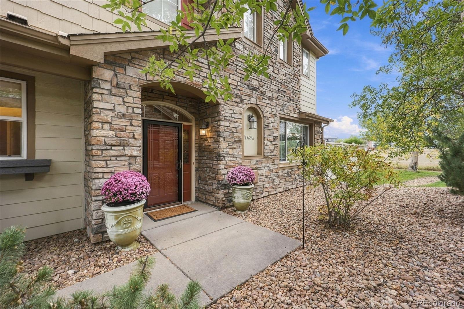 Welcome to this charming end unit townhome, perfectly positioned on a prime lot backing to open space. Soaring ceilings and an abundance of windows fill the open floor plan with natural light, while a cozy fireplace creates a warm and inviting atmosphere. The kitchen is well equipped with stainless steel appliances and granite countertops, and a quaint dining area provides the perfect setting to enjoy the views.  The main floor primary suite is a true retreat, featuring a luxurious five piece bath and a generous walk in closet. Upstairs, two versatile lofts offer exceptional flexibility, with the larger loft serving as a second family room and the smaller loft ideal for a home office. With two bedrooms, three baths, 1,901 square feet, and an attached two car garage, this meticulously maintained home offers comfort, privacy, and style.  Nestled in the highly sought after Highlands at Westbury community, this home offers easy access to Interstate 25, Boulder, Broomfield, and Downtown Denver. The HOA includes water, trash, sewer, snow removal, a community pool, clubhouse, tennis and basketball courts, and scenic walking paths. As an added bonus, Seller will credit Buyers at closing 6 months of HOA dues! All furniture is negotiable.