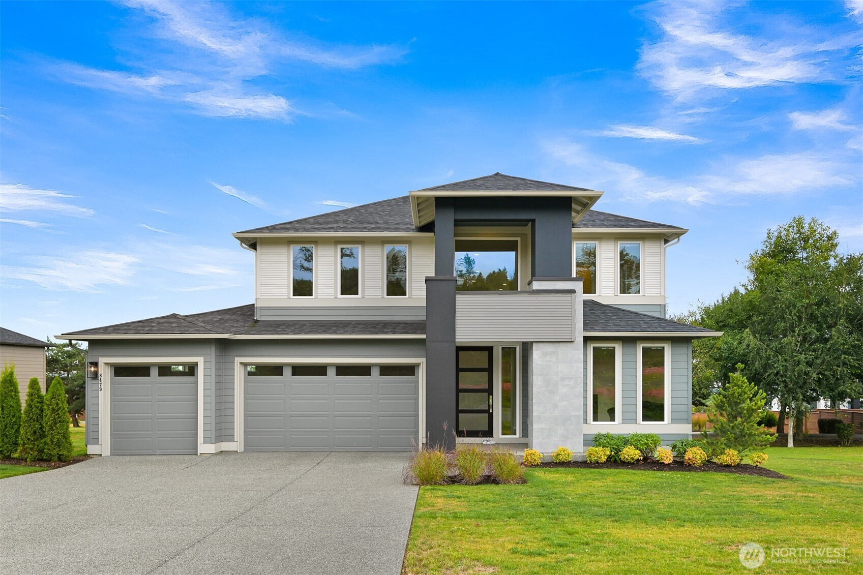 Welcome to Horizon, Blaine’s premier gated community, where exceptional design, privacy, and everyday luxury come together in this beautifully maintained, nearly new home. Built in 2024, this impressive residence offers over 3,100 square feet of thoughtfully designed living space featuring 4 bedrooms, 2.5 baths, a dedicated office, spacious bonus room, and an oversized 3-car garage.    A dramatic two-story entry opens to light-filled living spaces where soaring ceilings, expansive windows, and wall-height sliding glass doors create a seamless connection between the indoors and the covered outdoor living area. At the heart of the home, the gourmet kitchen features premium appliances, an oversized island, walk-in pantry, abundant cabinetry, and designer finishes that make everyday living as enjoyable as entertaining.    The main-floor primary suite offers a peaceful retreat with a spa-inspired bath, freestanding soaking tub, frameless glass shower, dual vanities, and an oversized walk-in closet. Upstairs, three generous bedrooms and a versatile bonus room provide space for guests, media, fitness, hobbies, or multigenerational living.    Premium upgrades, quality craftsmanship, energy-efficient construction, and meticulous care are evident throughout. Located minutes from Birch Bay, Semiahmoo, golf, beaches, parks, dining, and the Canadian border, this move-in-ready home offers the rare opportunity to enjoy luxury living in one of Blaine’s most desirable gated communities.