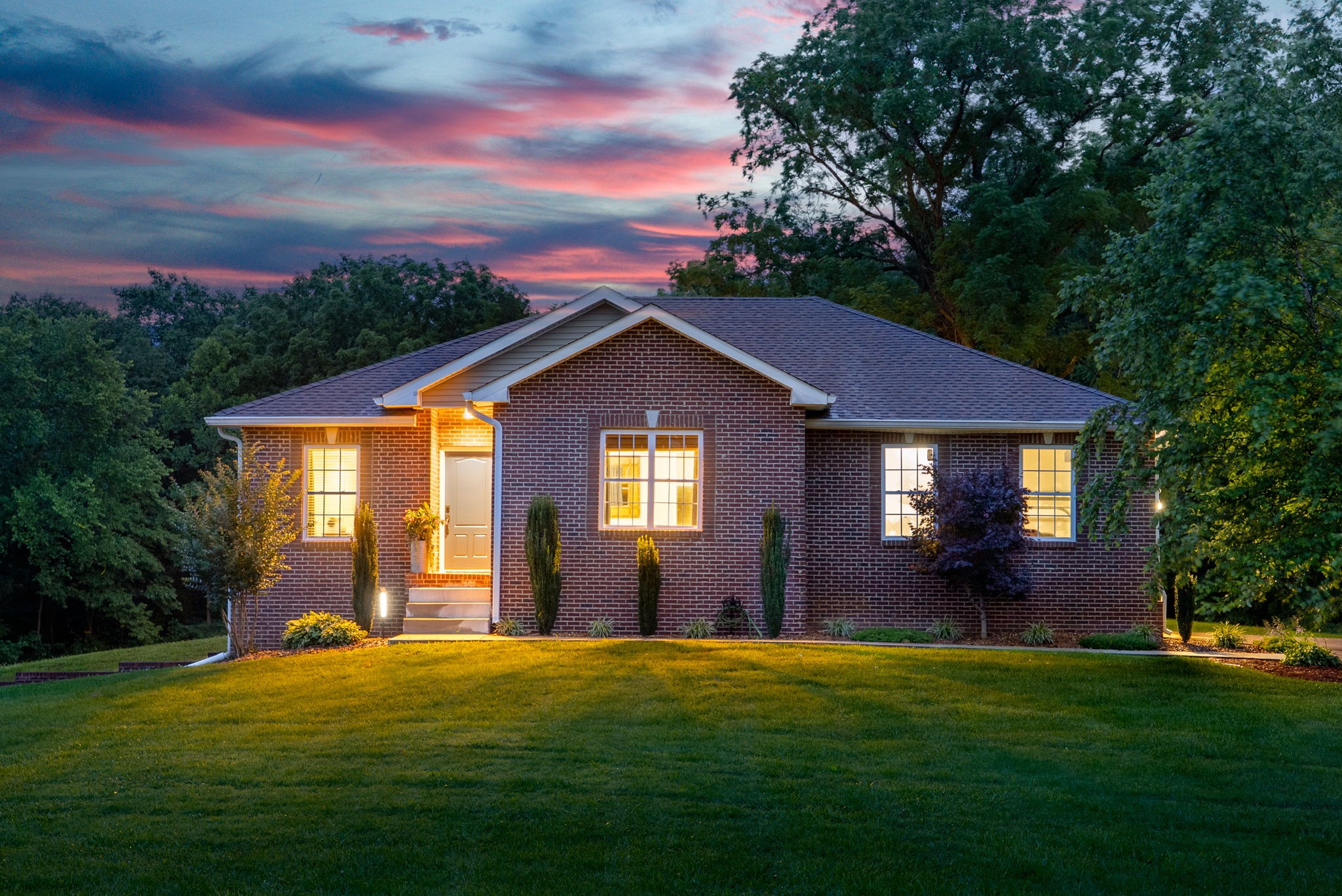 You may fall in love with the view, the privacy, and the kind of quiet you didn’t know you needed. 5 secluded acres, 8 minutes from Exit 11 on I-24, AND a custom built home?! Tucked far off from the road, this has it all. All four bedrooms on one floor, two and a half bathrooms to match. The kitchen features an eat in area and pantry cabinets. Living room acts as the perfect focal point of the home. Total of four garage spaces with two on each floor. That's right, your basement features 1,900 square feet of potential! Your land backs up directly to the Red River and embodies the country setting of privacy without having to drive an hour from Clarksville! Call today to come see what the rest of your life looks like.
