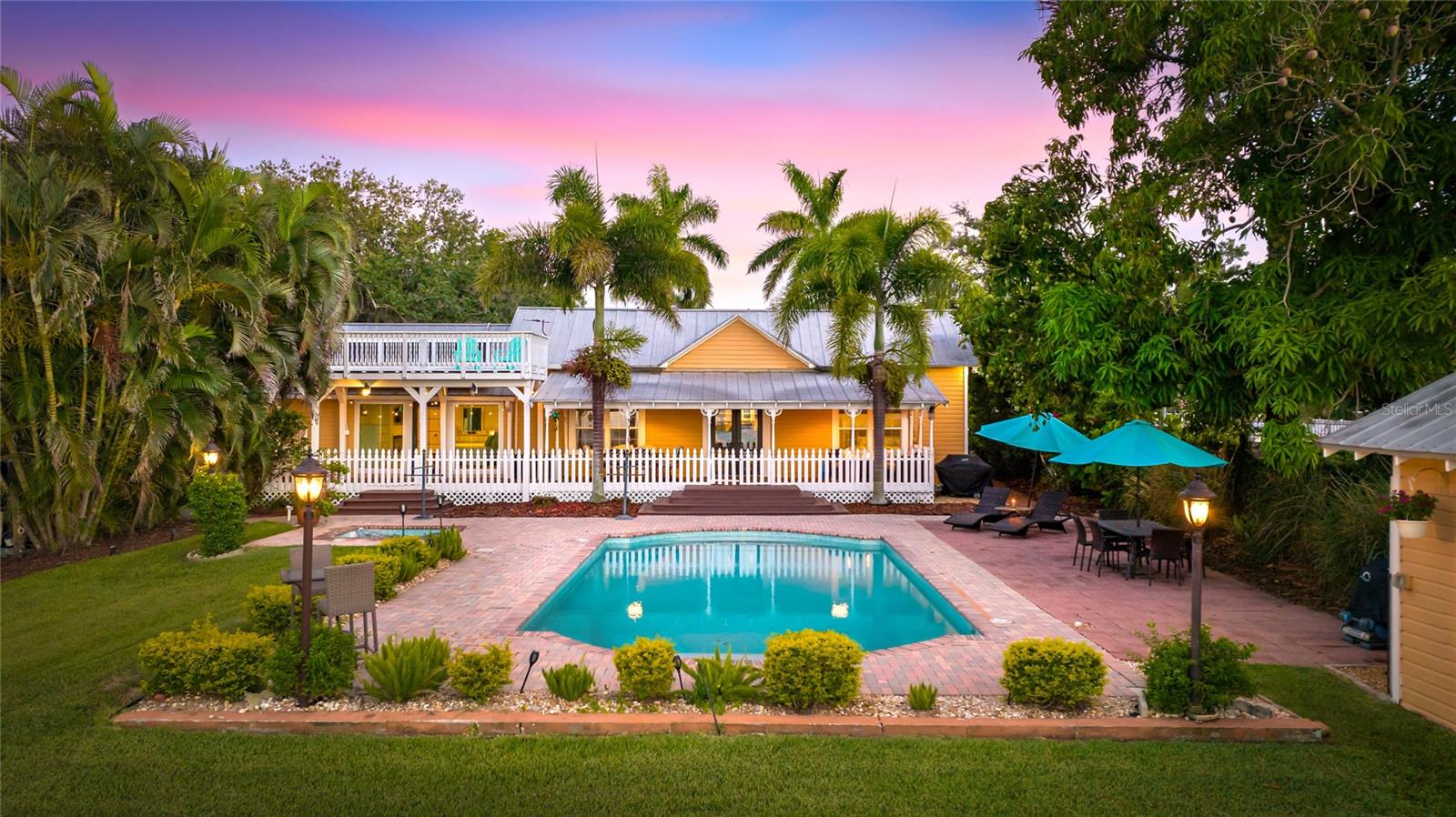 **BOATER’S PARADISE – RARE DIRECT ACCESS RIVERFRONT WITH EXCELLENT WATER FRONTAGE**Welcome to a truly exceptional waterfront retreat—rarely available and magnificently restored Key West–style home offering over 100 feet of direct-access river frontage with no HOA fees or restrictions. Tucked away on a quiet dead-end street, this private oasis delivers breathtaking, unobstructed views of the Manatee River from your own backyard.Boating enthusiasts will appreciate the private 120 foot long dock equipped with electric, water, and a brand-new 16,000 lb boat lift—providing effortless access to the river, Tampa Bay, the Gulf of Mexico, and nearby waterfront dining. Enjoy unforgettable sunsets and even fireworks displays right from your dock.This home seamlessly blends historic charm with modern luxury. Original details such as glass doorknobs, clawfoot tubs, pine hardwood floors, crown molding, wainscoting, French doors, and intricate woodwork are complemented by thoughtful upgrades throughout. The spacious interior boasts soaring 10-foot and vaulted ceilings, filling the home with natural light and an airy coastal feel.The fully updated kitchen features 42” cabinetry, new granite countertops, KitchenAid stainless steel appliances, custom lighting, tile backsplash, and new tile flooring and is adjacent to a quaint semi private sitting area which is perfect as a reading or relaxing place.Step outside and experience true Florida living with multiple outdoor spaces, including three covered porches, a second-floor observation/sunning deck, and a stunning newly resurfaced heated pool with an electric heater and gas spa. A unique copper outdoor shower adds to the resort-style ambiance.The 1 bedroom renovated pool house with a private bathroom offers incredible flexibility—ideal as a guest suite, fourth bedroom, home office, or studio.Designed for comfort, efficiency, and peace of mind, the home includes:* Hurricane-impact windows and doors throughout* Whole-home generator with 500-gallon owned propane tank and smartphone control* Solar panel system with app monitoring* Whole-home security system with cameras and remote access* Mosquito Nix misting system for full perimeter coverageThe fully fenced property is lushly landscaped with tropical plantings including pineapple, banana, coconut, lemon, lime, and mango trees—creating your own private paradise.Located in the historic city of Manatee, you are very close to the Bradenton Riverwalk and just minutes to downtown Bradenton’s vibrant restaurants, bars, and farmers market. Enjoy a quick 5-minute boat ride to Pier 22, easy access to I-75, and proximity to top-rated schools such as St. Stephen’s and IMG Academy.Move-in ready and truly one-of-a-kind, this property offers the ultimate waterfront lifestyle. Investors welcome. Furniture available upon request.Schedule your private showing today and experience riverfront living at its finest.