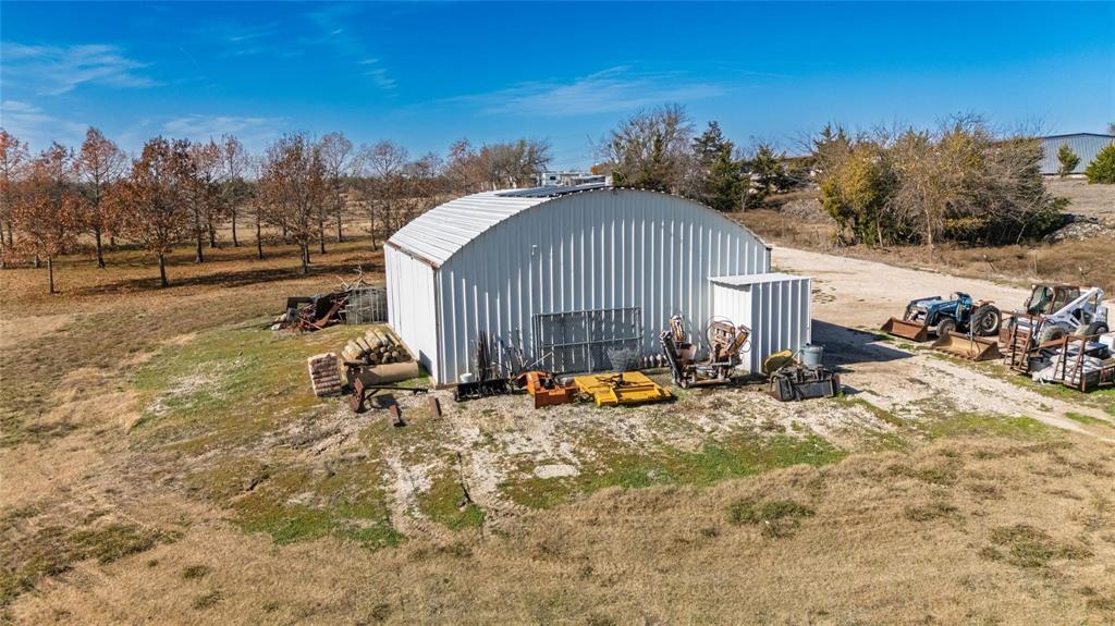 Prime 6.08 acres of land inside the city limits with a large Workshop! ideally positioned adjacent to residential growth and outdoor recreation, you'll find this prime lot near Lake Lavon and Collin Park Marina. This versatile tract offers outstanding potential for development, owner-user operations, or long-term investment in a high-demand area. Excellent access and proximity to Lucas, Wylie and St. Paul make this a rare acreage opportunity. Existing metal building and pond provide endless possibilities. Buyer to verify zoning and permitted uses. Additional house on 1.8 acres that adjoins it, can be bough together to make it a house, pond, workshop, and 7.894 total acres. Lots of options with this parcel in the Wylie school district!