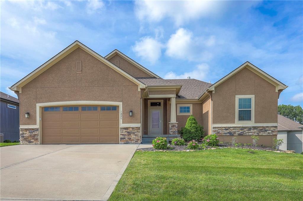 This beautiful home is located in a maintenance provided area in the Creekmoor golf course community is the popular Portland plan by SAB. A short, leisurely stroll will lead you to the clubhouse, where you can indulge in culinary delights at the restaurant, soak up the sun by the pool, challenge your friends to a game of tennis, or maintain your fitness regimen in the well-appointed exercise room. The home boasts of 3 bedrooms, 3 baths, and an open floor plan with lots of natural light. The great room, kitchen, dining room, laundry room, primary suite and a second main level bedroom that provides flexibility & convenience, ideal for guests or a home office are all on the main level. The kitchen boasts granite countertops, a walk-in pantry, stainless steel appliances including a refrigerator and gas stove. An additional guest bedroom and bath are on the lower level, as well as a family room, game space, patio and plenty of storage space.  Enjoy the great outdoors on the screened-in covered deck that is just off the dining room. With its perfect combination of location and lifestyle this home promises a wonderful living experience.