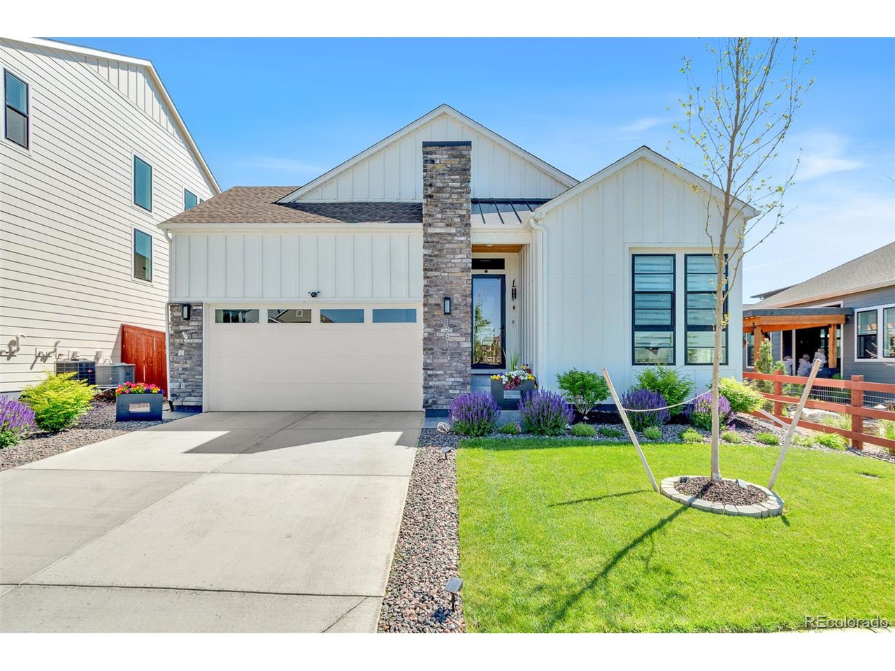 Welcome to the desired Sub Area of Raindance in Windsor Colorado! This immaculate property offers 5 bedrooms, 4 bathrooms, a flex room/office, the fully finished two car garage features custom hot water faucet with epoxy flooring.  The main level features brand new gray stained wood flooring throughout, a gourmet kitchen with ample cabinet space, waterfall kitchen countertops, walk in pantry, gas range top. The living room features a floor to ceiling backsplash gas fireplace that is absolutely beautiful. Power remote window shades and new LED light fixtures. Enjoy walking out from your main level to an oversized patio with rod ironed railing, privacy wall, custom winter proof tv cover with LG TV with a 110 electrical outlet included, custom cedar ceiling and a plumbed gas line for grilling! Three bedrooms on the upper level with a bonus flex room/office area and a laundry room for convenience. Your large primary bedroom features a five-piece bathroom with an oversized shower, free standing bathtub, double vanities and a massive walk-in closet. Enjoy dual zone thermostats and OLEO Lighting on the exterior. The newly finished basement offers an open concept area, a full wet bar with custom 10' quarts countertop. two huge bedrooms one with a walk-in closet, a dedicated workout area with rubber flooring. The designer bathroom in the basement offers a 72-inch square sink quartz double vanity countertop, with overhead rainfall shower. Amazing location with festival park directly in front of the home. Raindance National Golf course which is the longest course in the United States is .2 miles away from hole 1! Hoe Down sledding Hill is a block away. Golf pro-shop and Grainhouse bar within walking distance (1 block) This is truly a one-of-a-kind custom home and a must see in person!